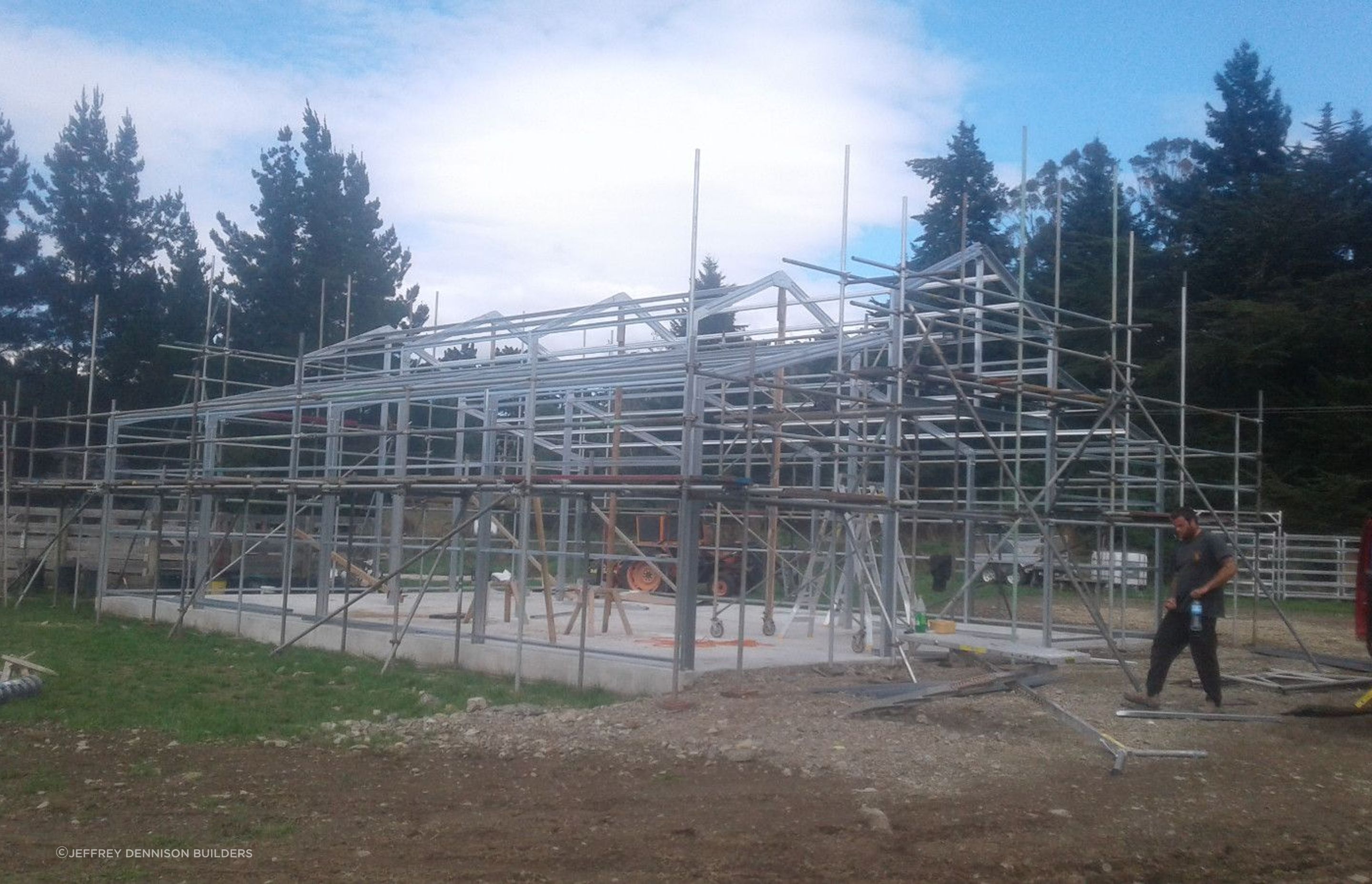Scaffolding being erected, steel framing making progress.