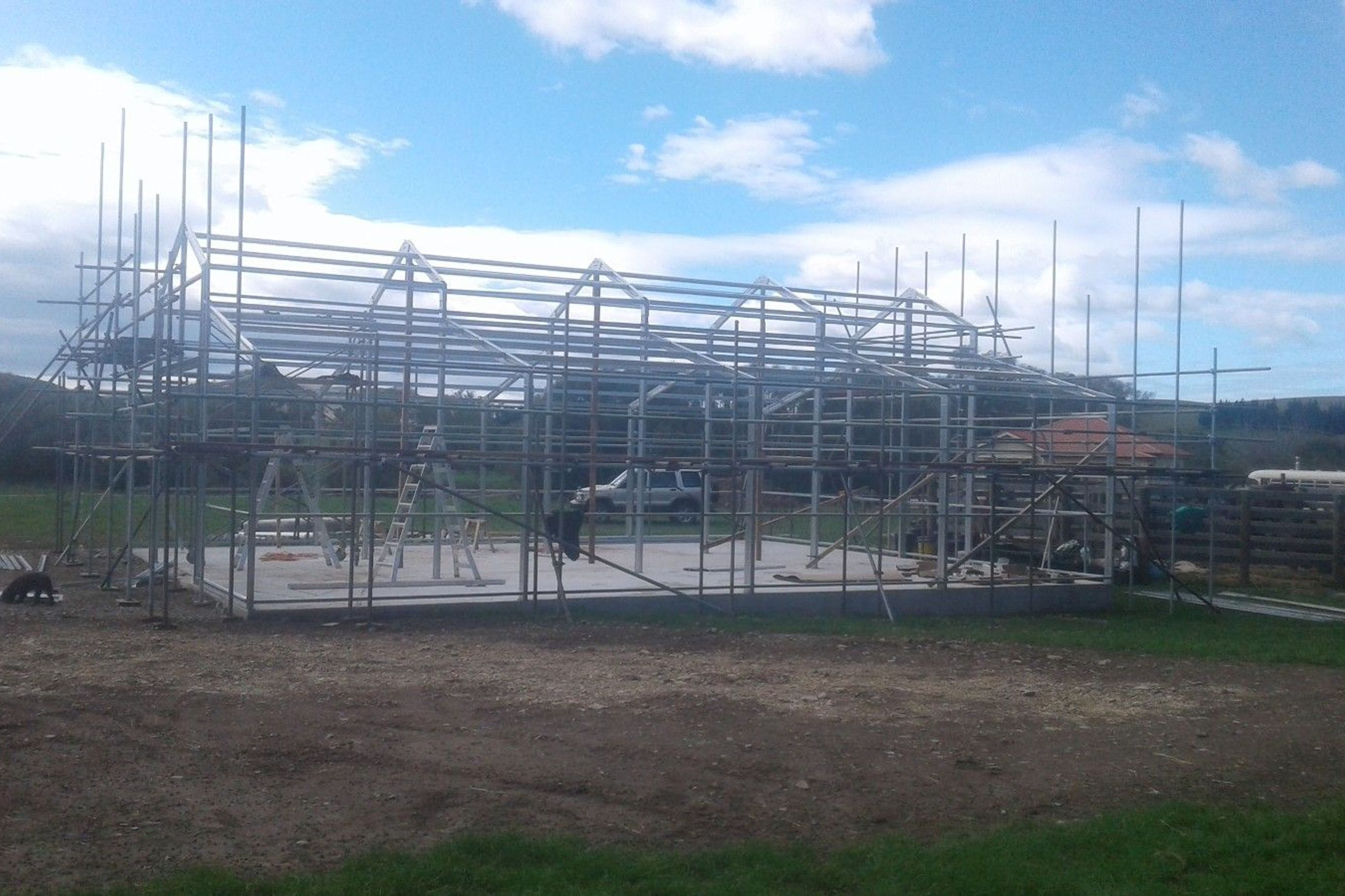 Scaffolding being erected higher, steel framing almost complete