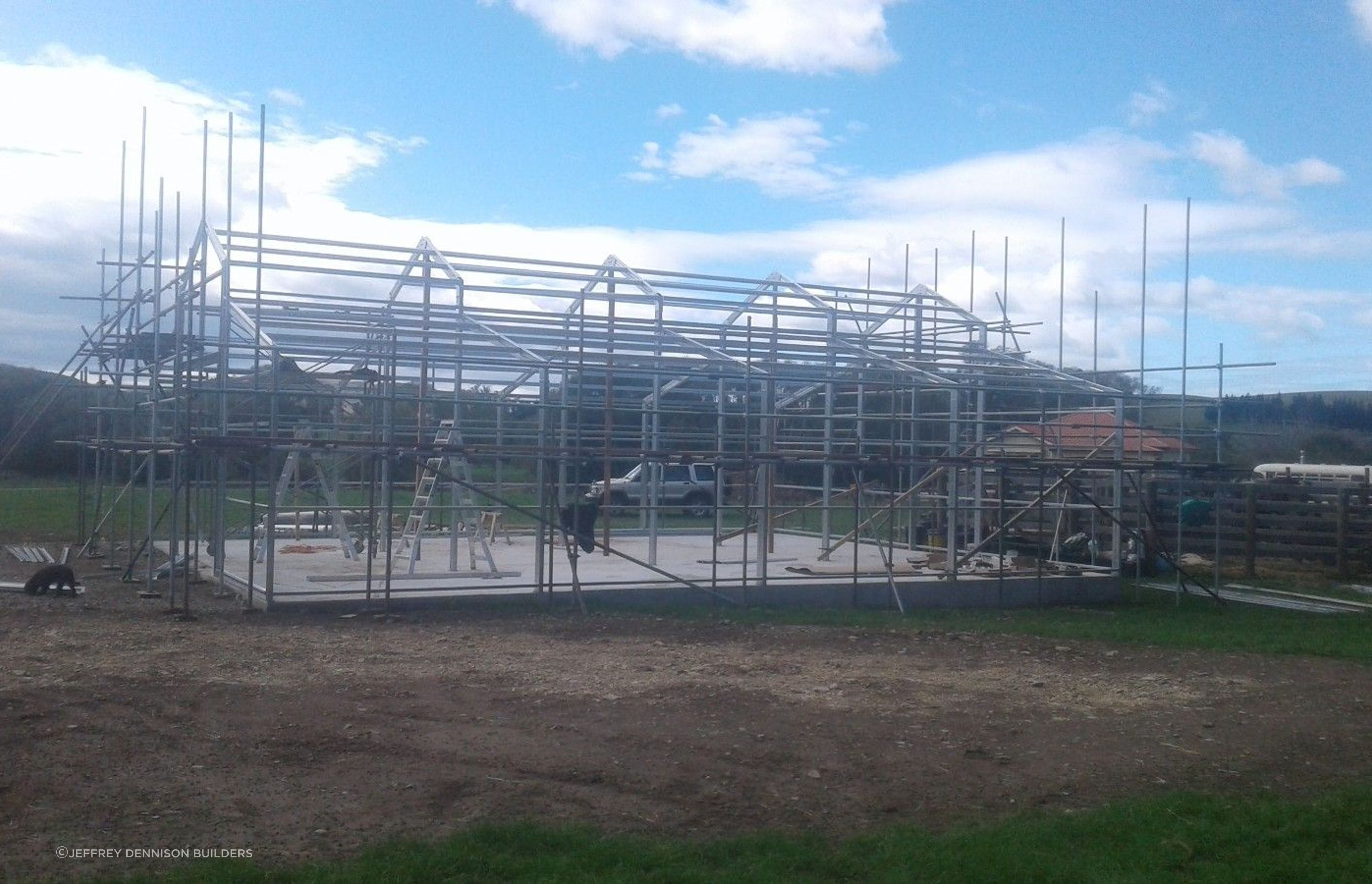 Scaffolding being erected higher, steel framing almost complete