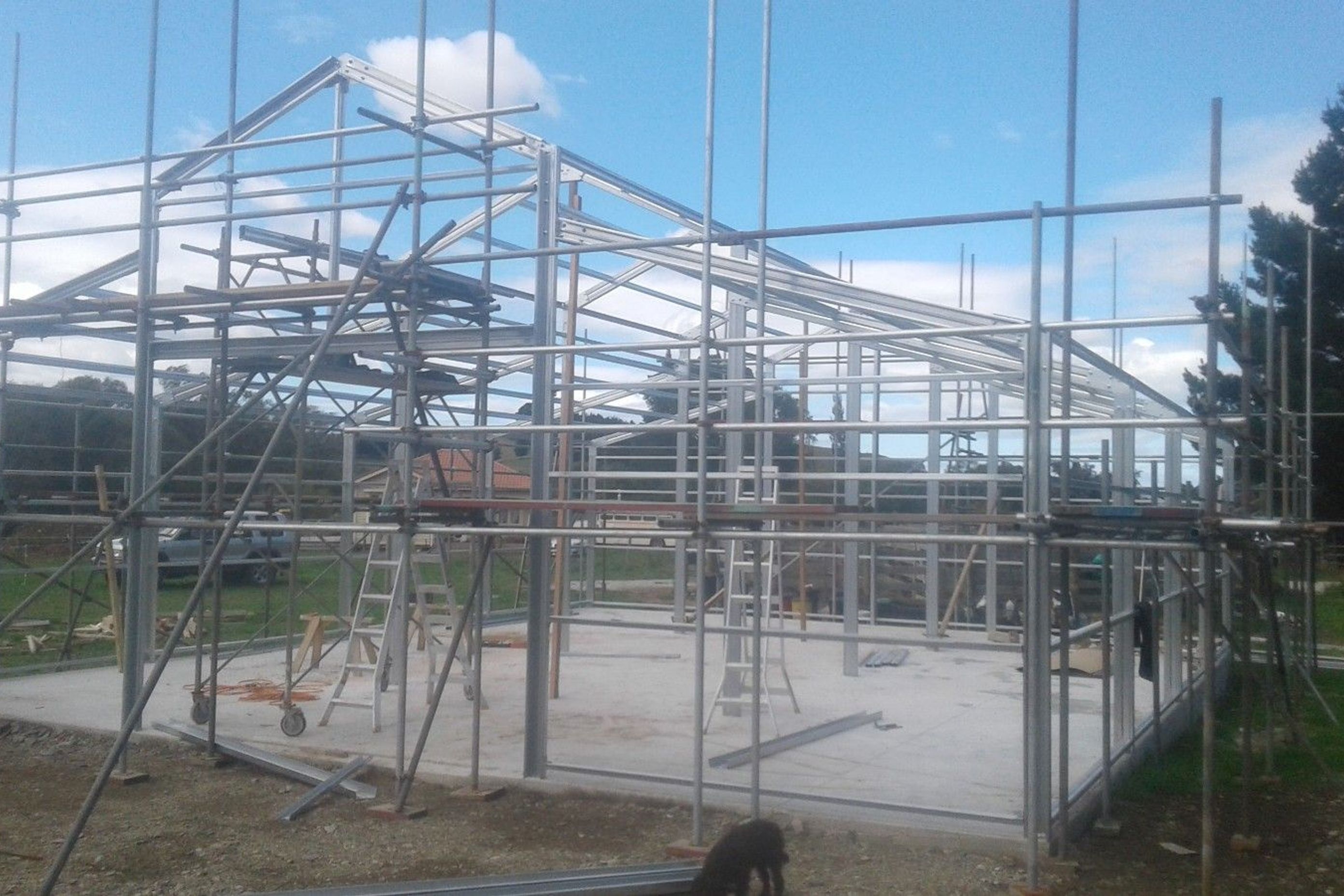Scaffolding being erected higher, steel framing complete