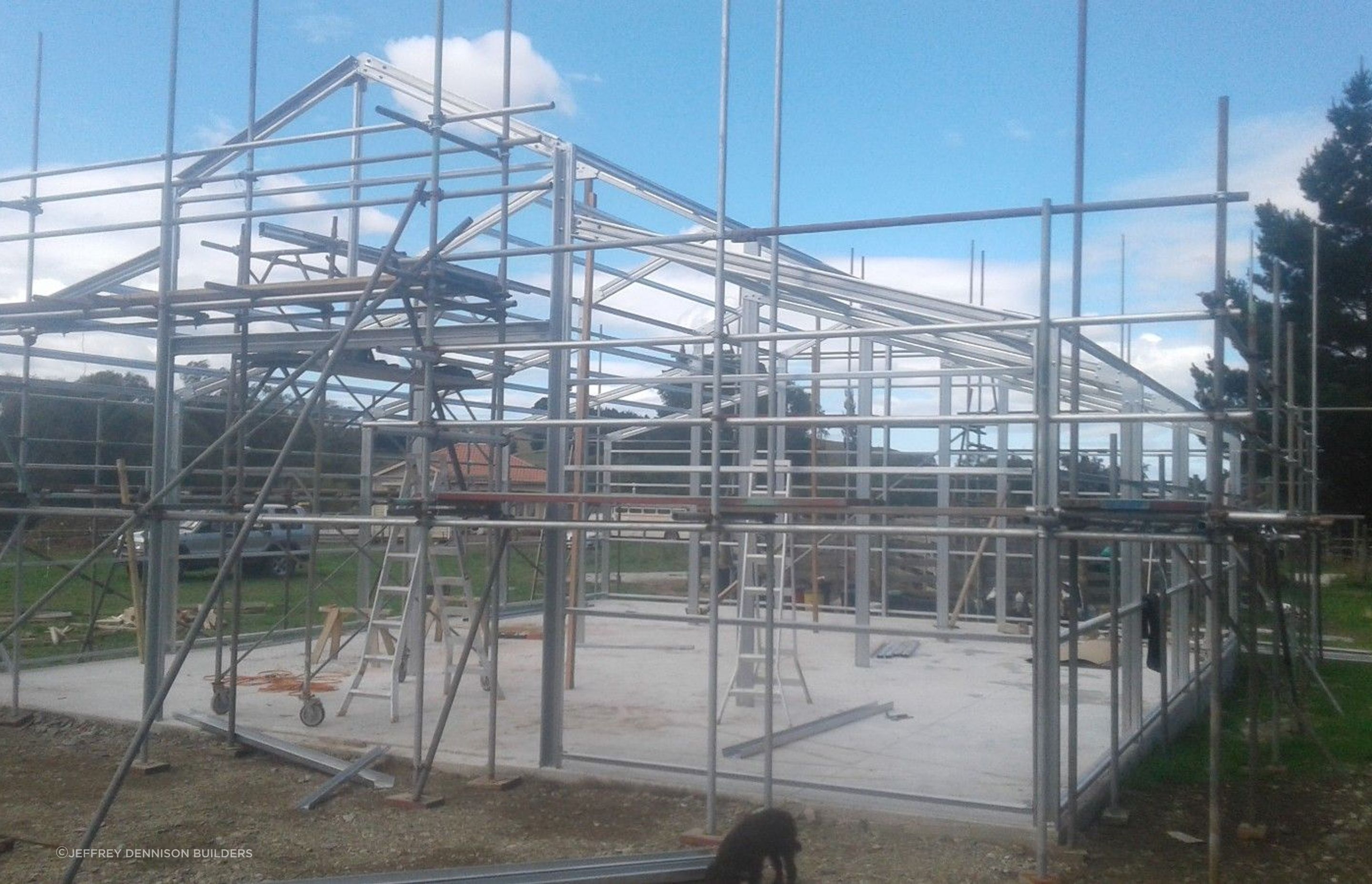 Scaffolding being erected higher, steel framing complete