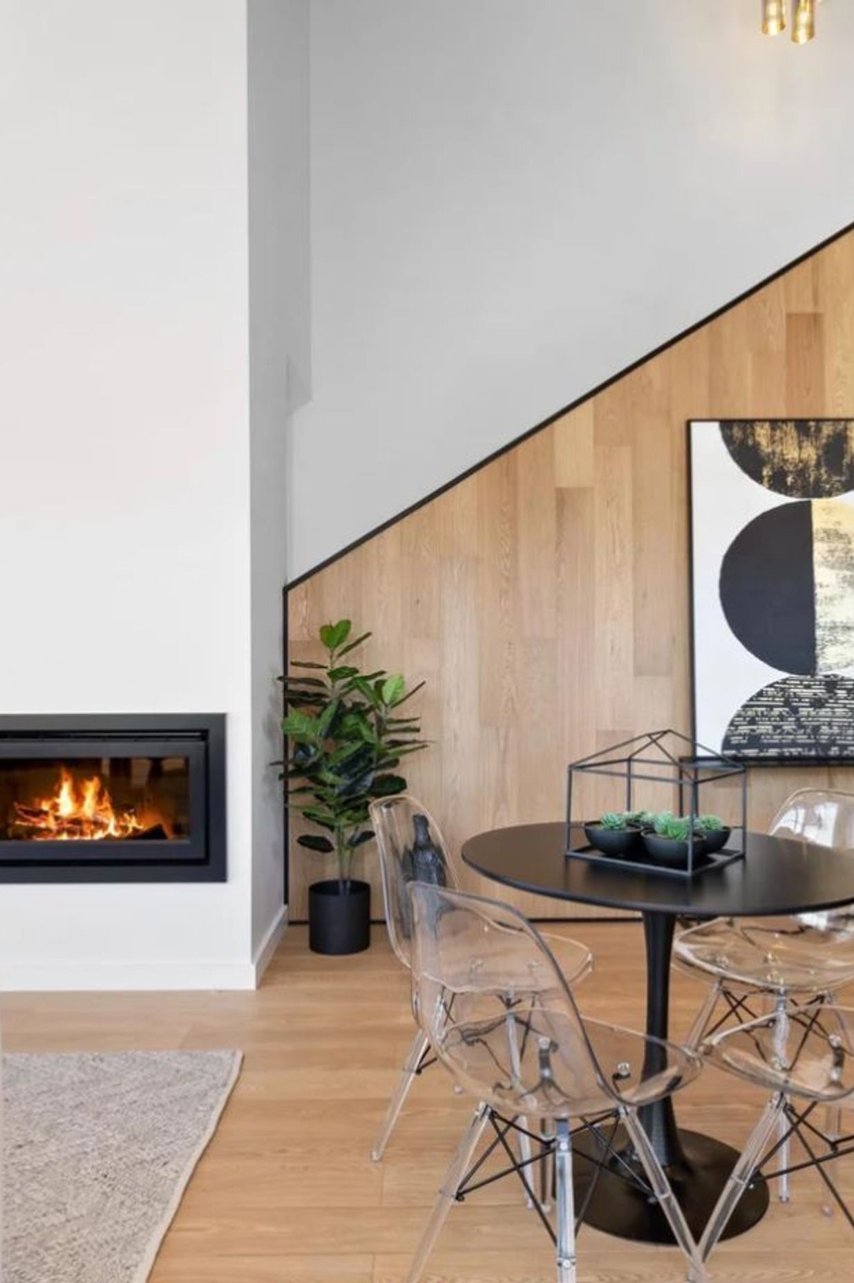 Timber feature wall and cosy Escea gas fireplace.