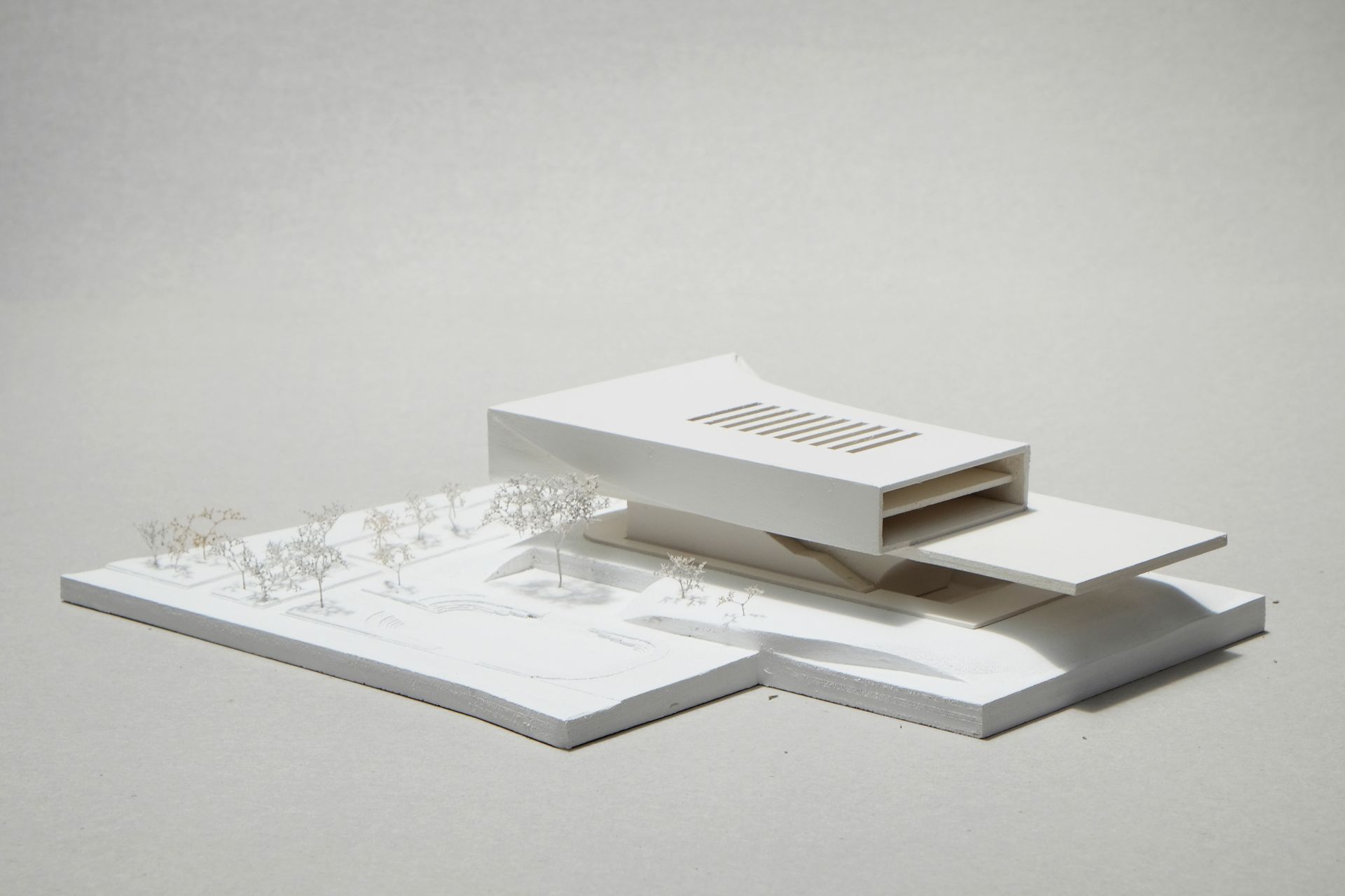 Elevation - the geometry sweeps upward from the Neue Nationalgalerie roof alignment