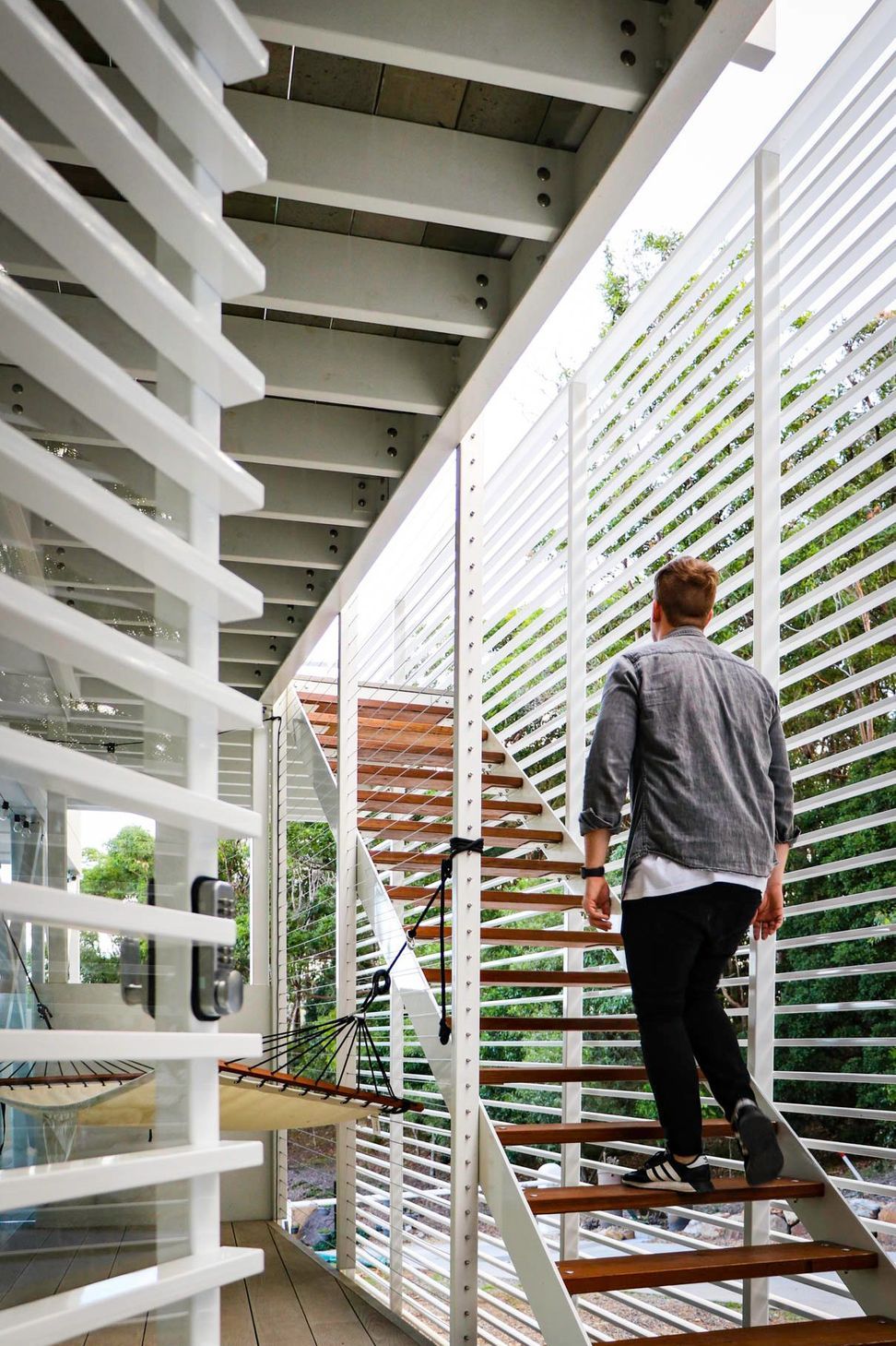 105 Residence - Staircase. Climbing the external timber stair.