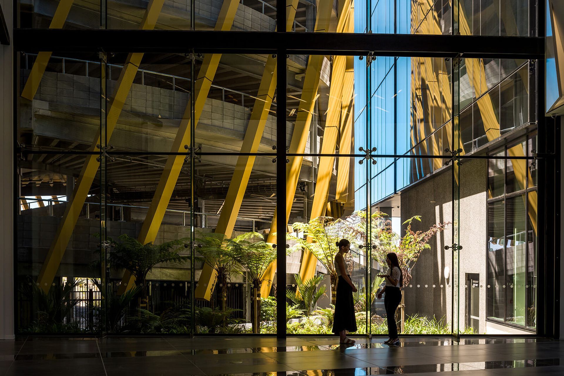 The stunning three-storey-high light-filled atrium interconnects the car parking and office spaces.