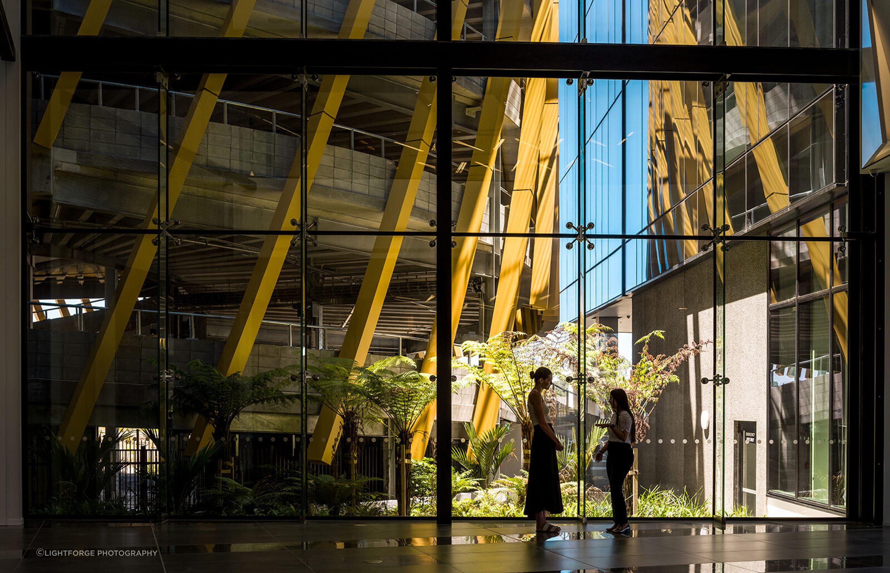 The stunning three-storey-high light-filled atrium interconnects the car parking and office spaces.