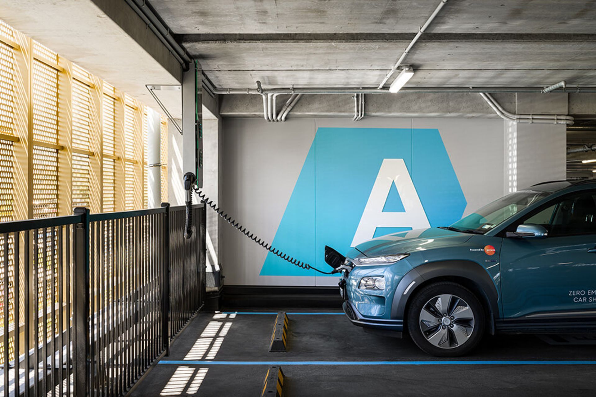 There are a number of free EV chargers in the car parking building for the tenants.