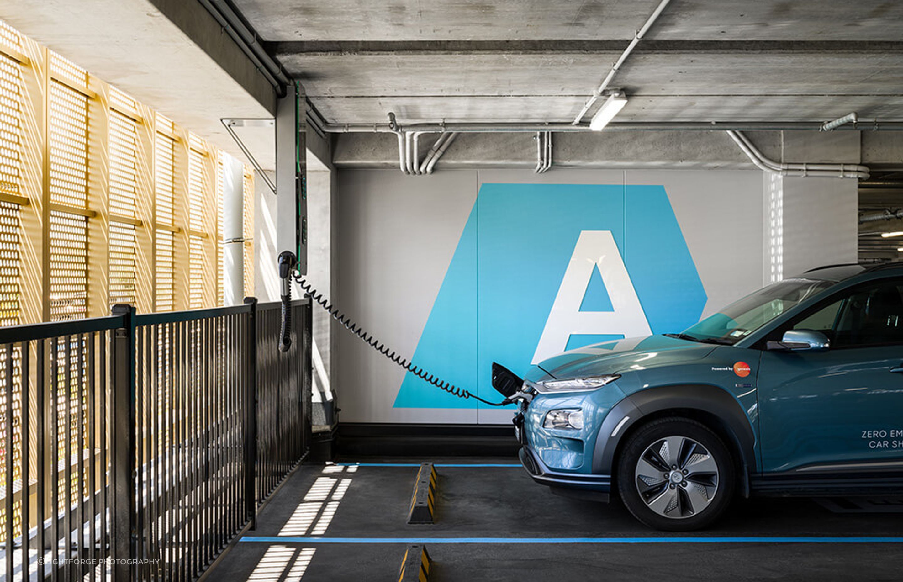There are a number of free EV chargers in the car parking building for the tenants.