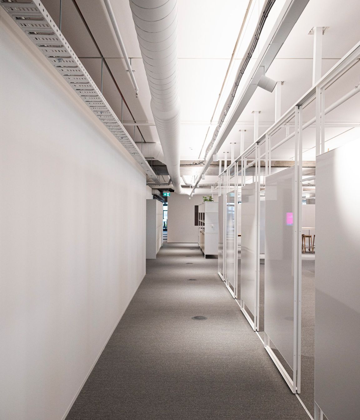 A sliding track allows these whiteboards to move and transform spaces. Studco engineering ensured that open plan spaces such as this office floor were feasible.