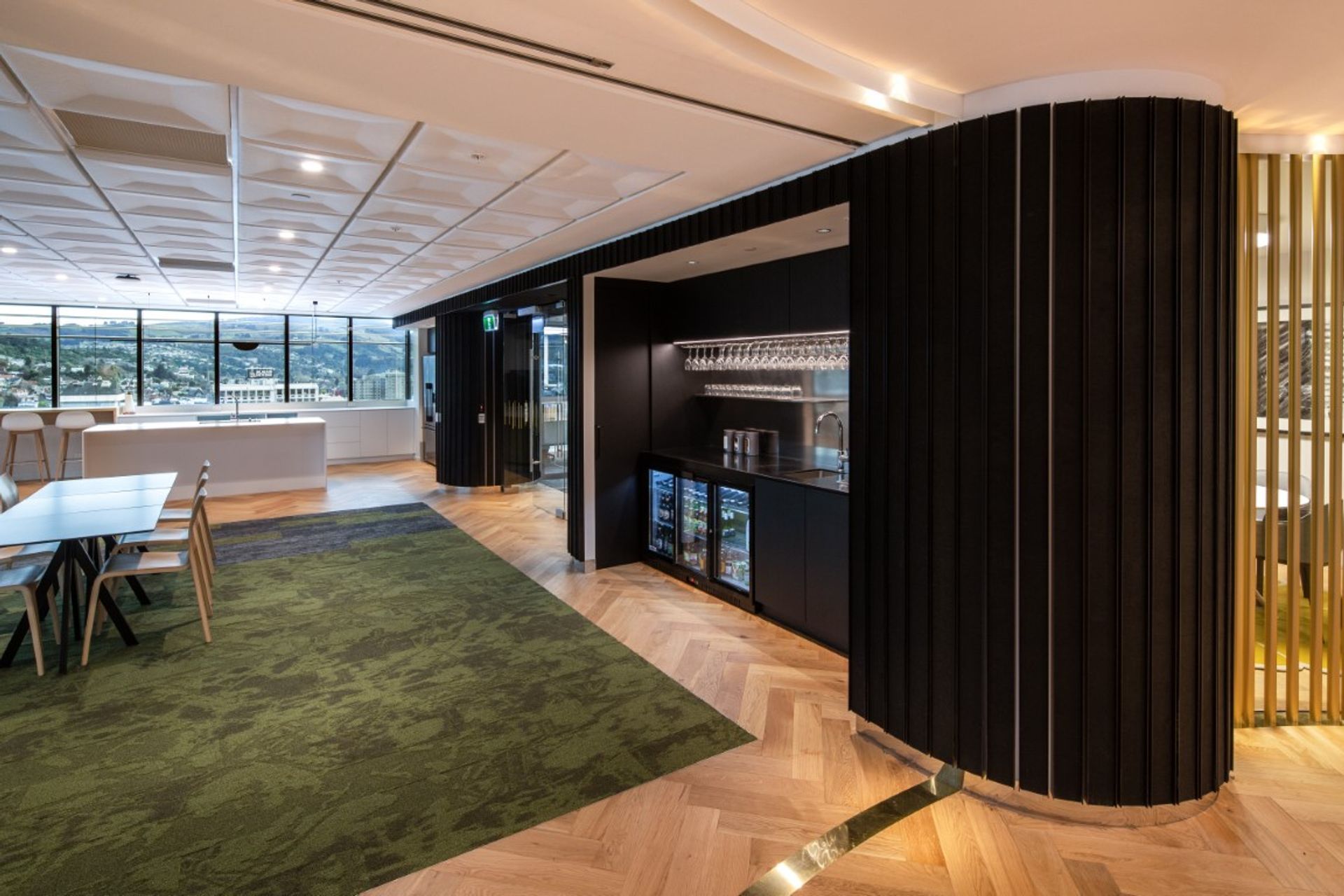 Cafe - kitchen & bar amenities within dark acoustic wall