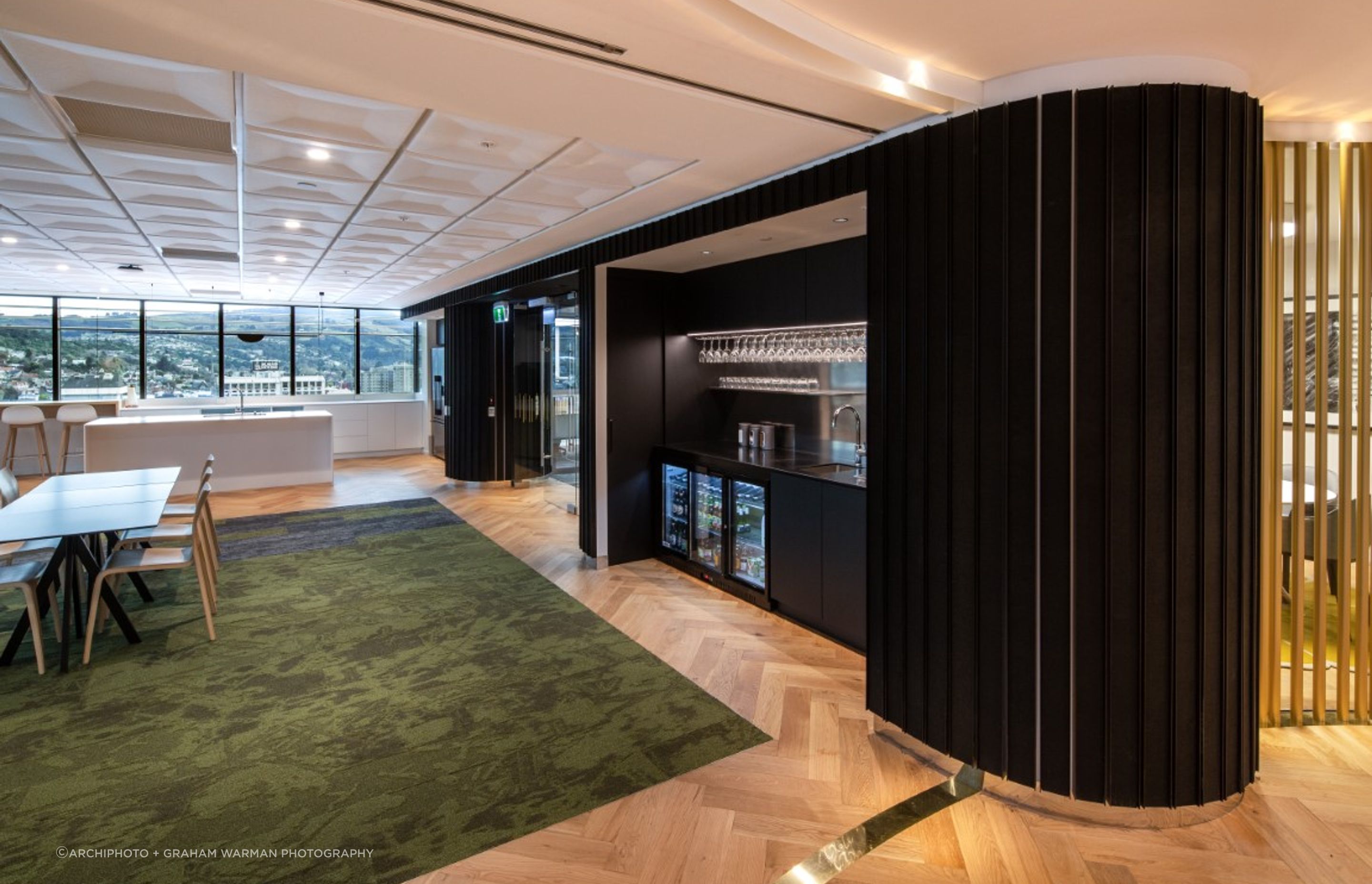 Cafe - kitchen & bar amenities within dark acoustic wall