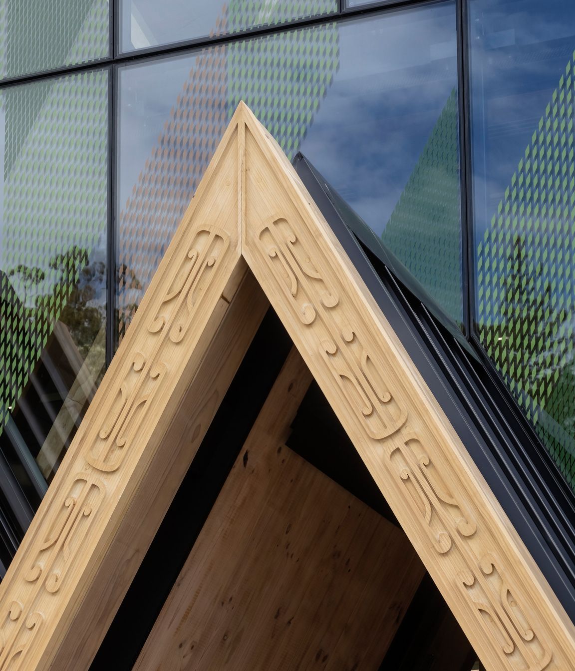 Machine-routed carving, designed by local carver Grant Marunui, adorns the 'triple peak' entrance to the centre.