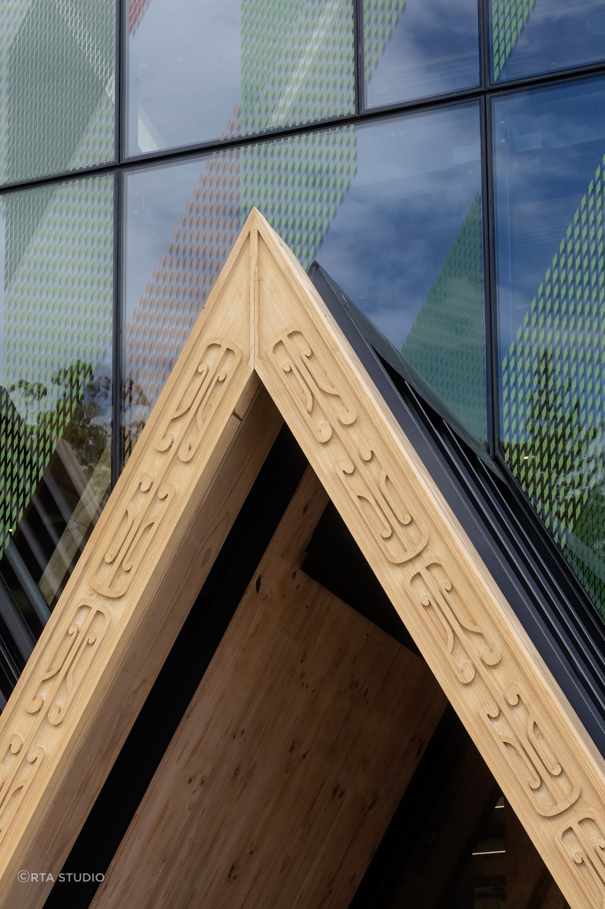 Machine-routed carving, designed by local carver Grant Marunui, adorns the 'triple peak' entrance to the centre.