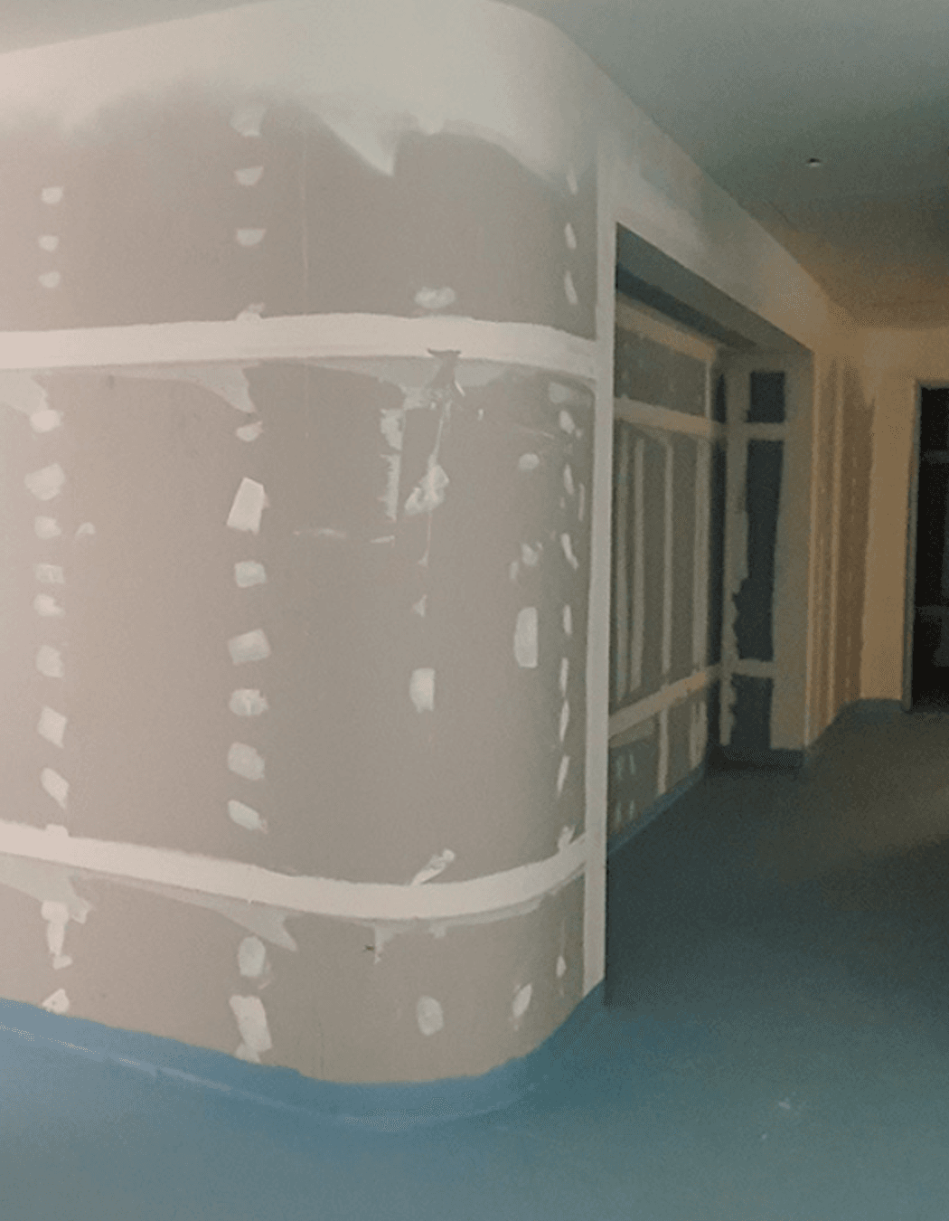 Studco EzyTrack used to create curved walls which include storage spaces. The finished curved walls provide function and aesthetic, adding to the flowing curves of Wesley Place.