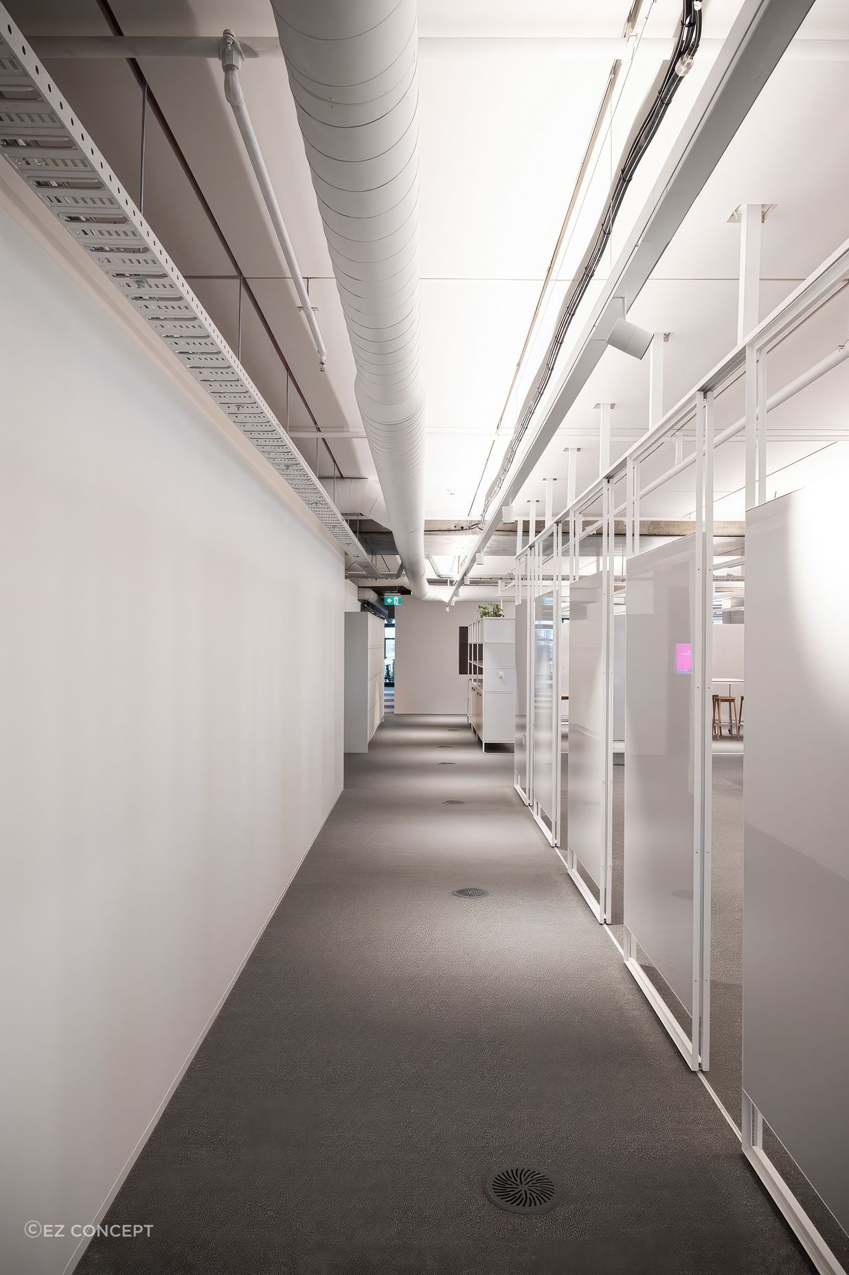 A sliding track allows these whiteboards to move and transform spaces. Studco engineering ensured that open plan spaces such as this office floor were feasible.