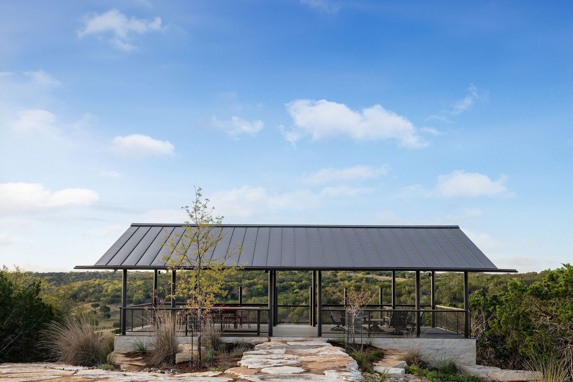 02RanchRecreationCuppettKilpatrickArchitectureandInteriorDesignaustin-tx-shooting-pavilion-hill-country-texas-rock-path.jpg