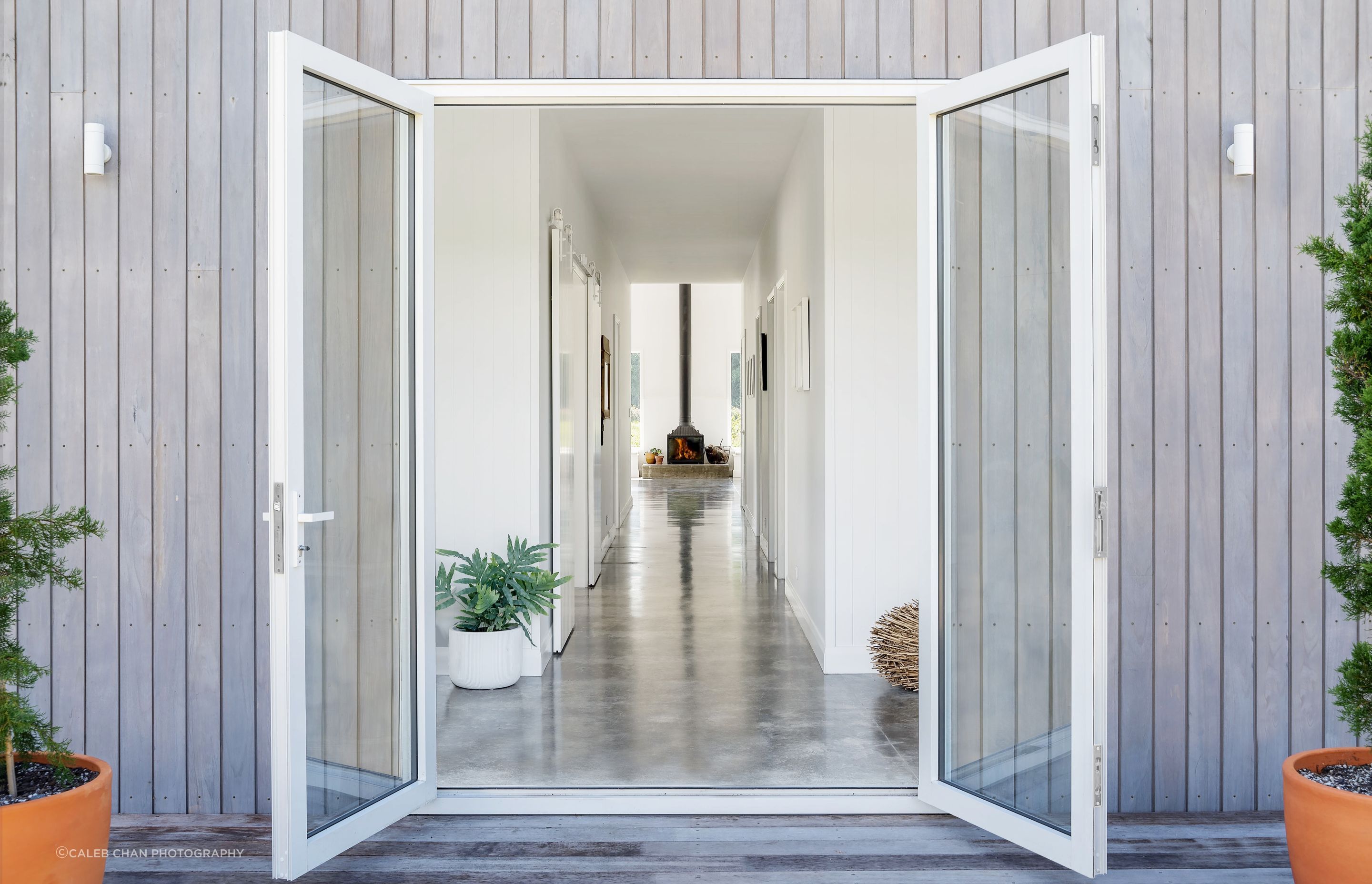 The glass front French doors provide a glimpse of the grand living space upon entering the home.