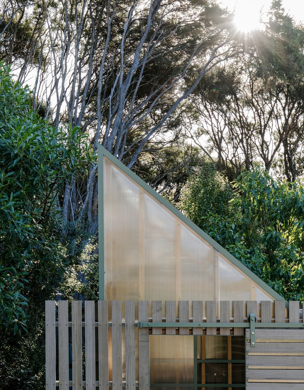 The exterior has been left to silver off mimicking the kānuka trunks.