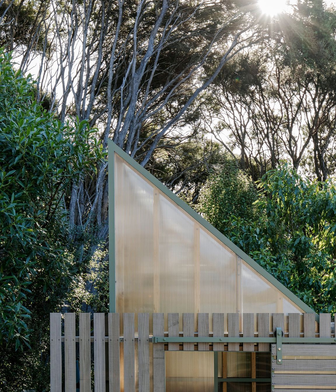 The exterior has been left to silver off mimicking the kānuka trunks.
