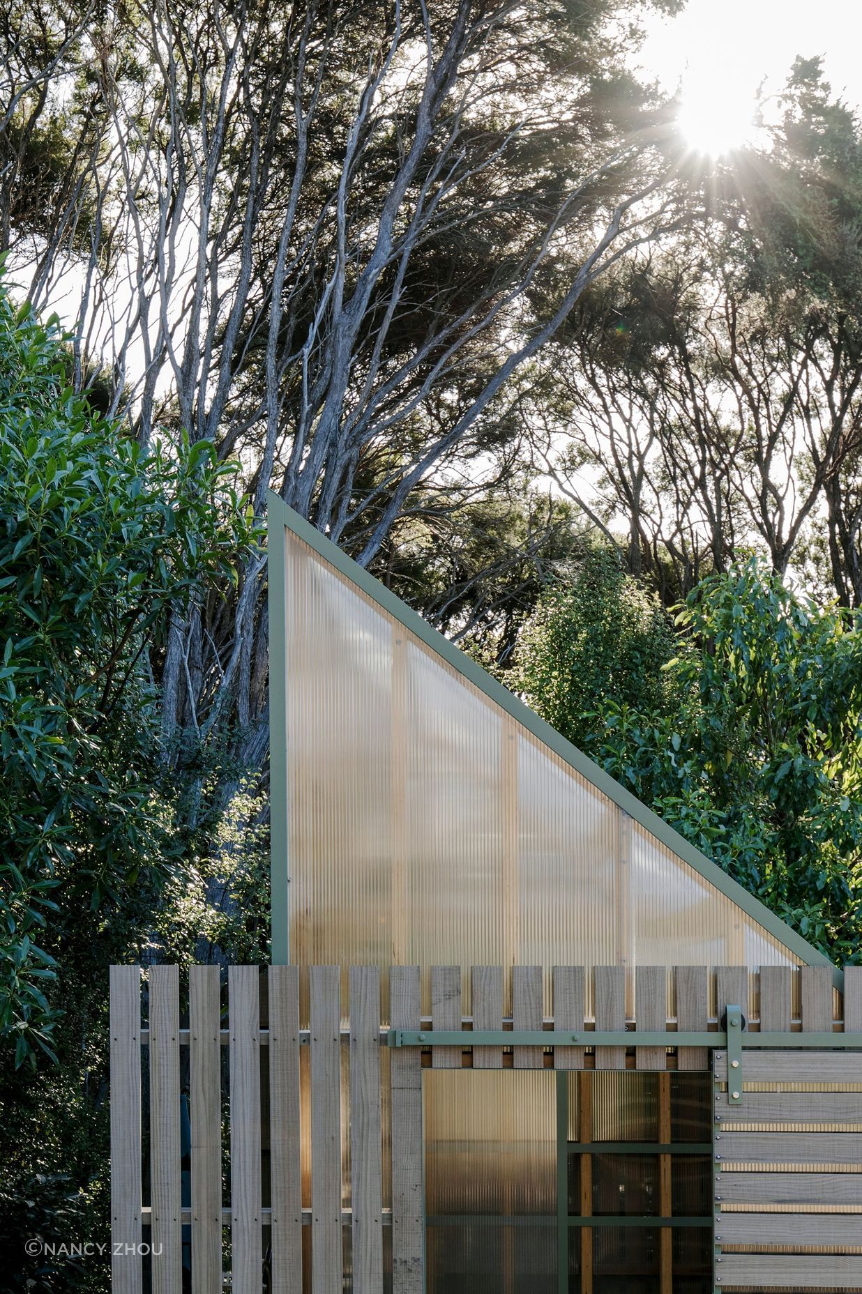 The exterior has been left to silver off mimicking the kānuka trunks.