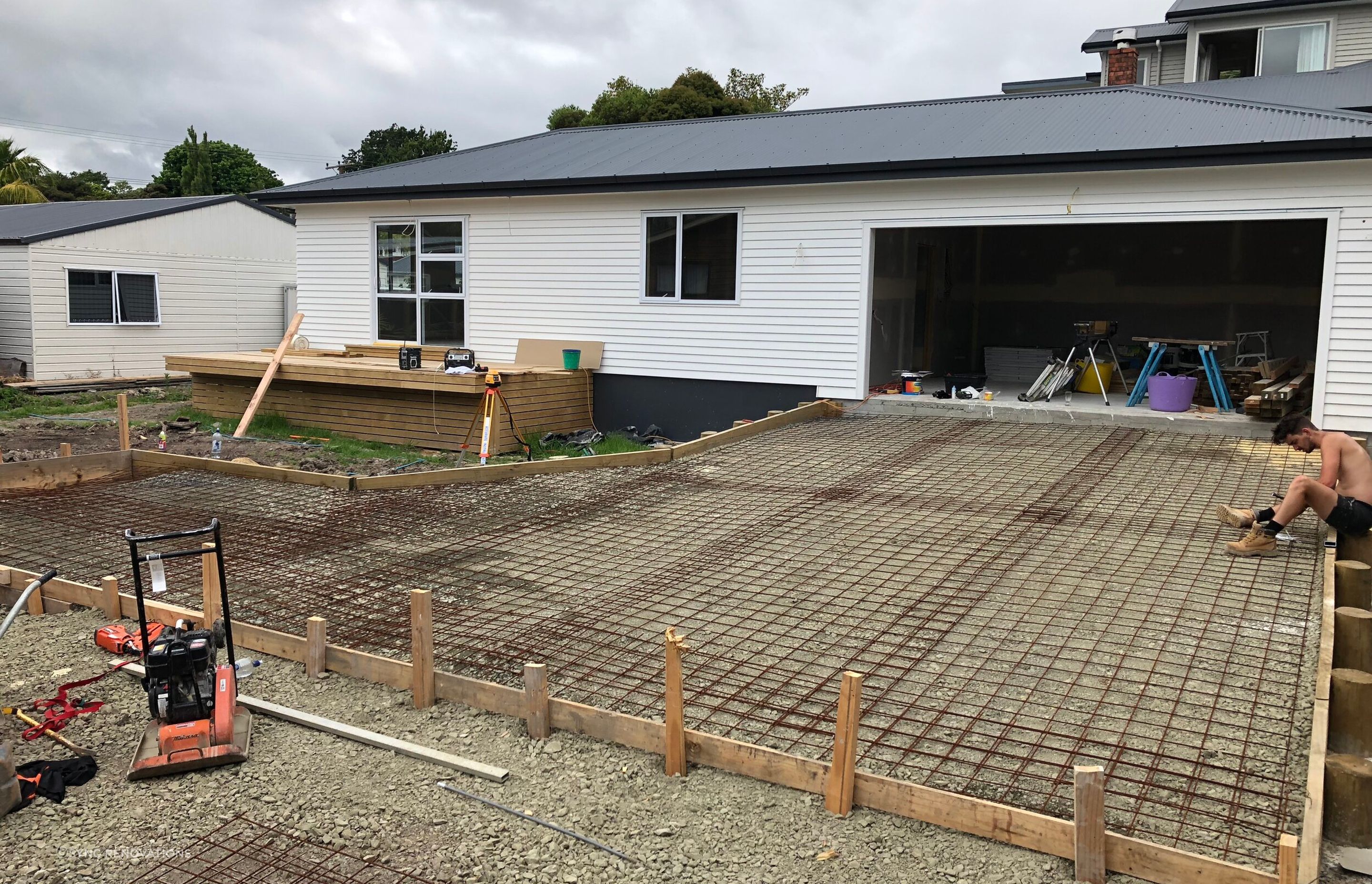 The house exterior nearly complete, the pourers concrete driveway being prepared
