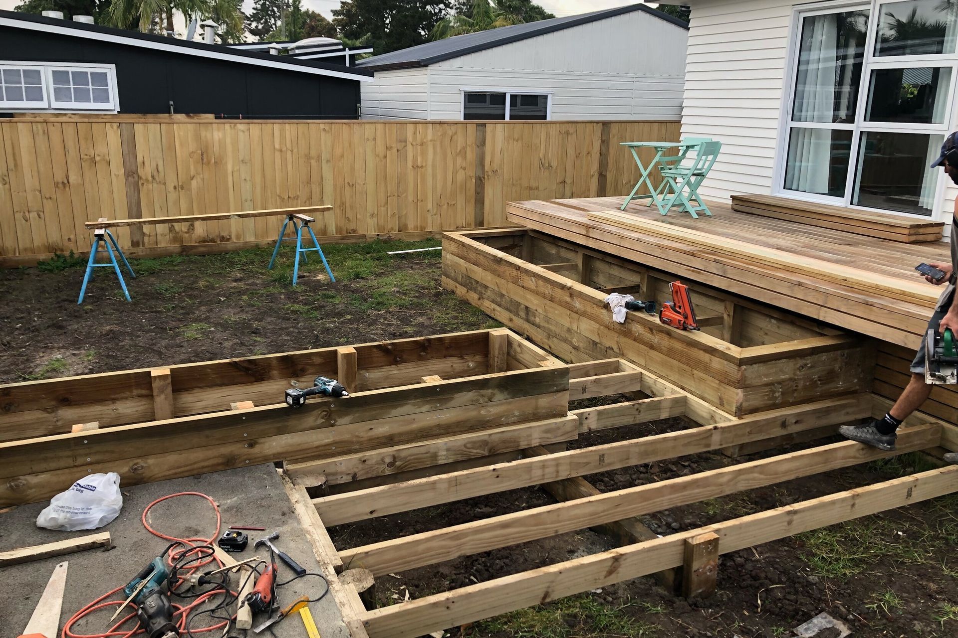 The built in garden beds, deck and pathways leading to the driveway
