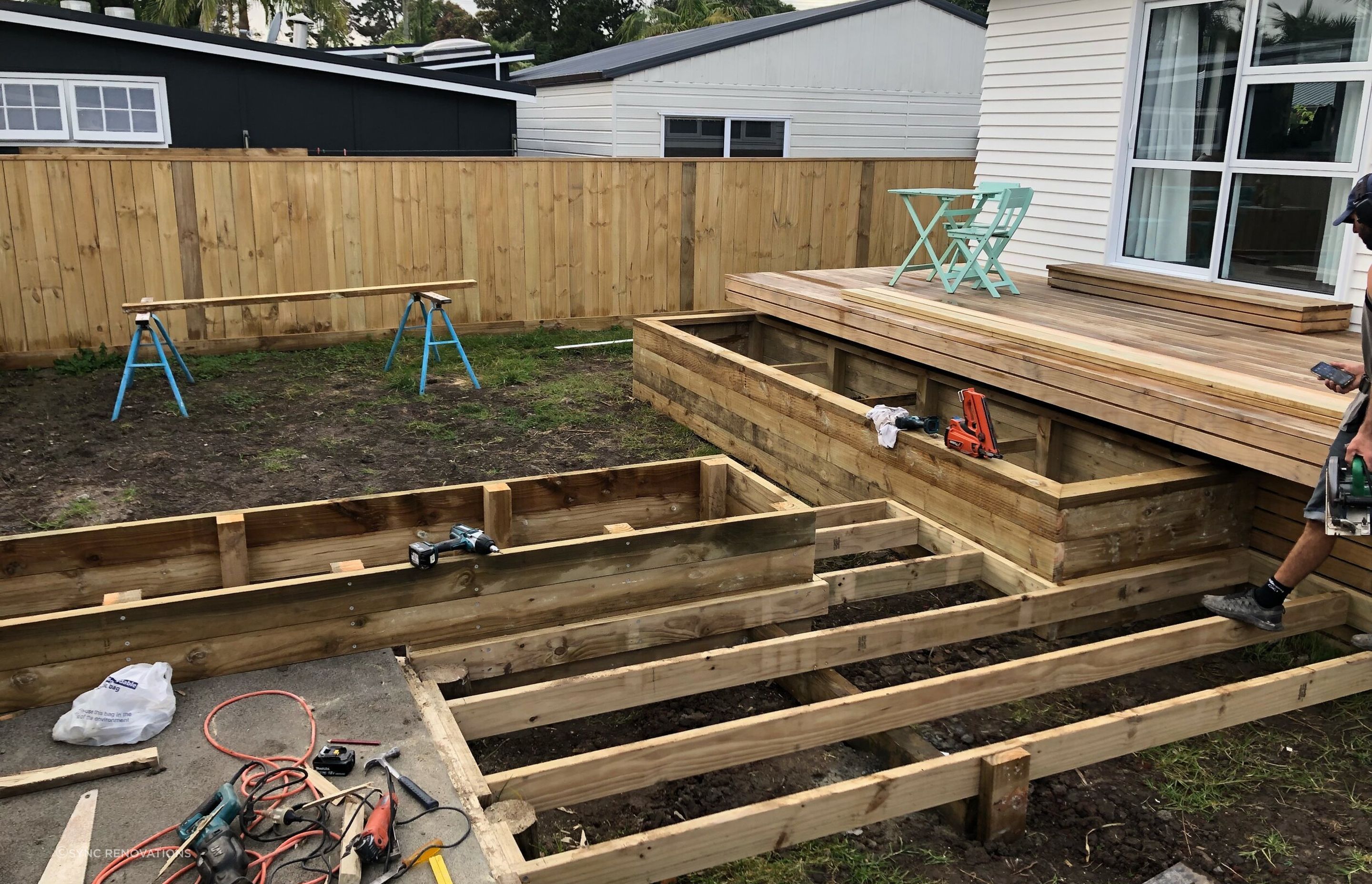 The built in garden beds, deck and pathways leading to the driveway