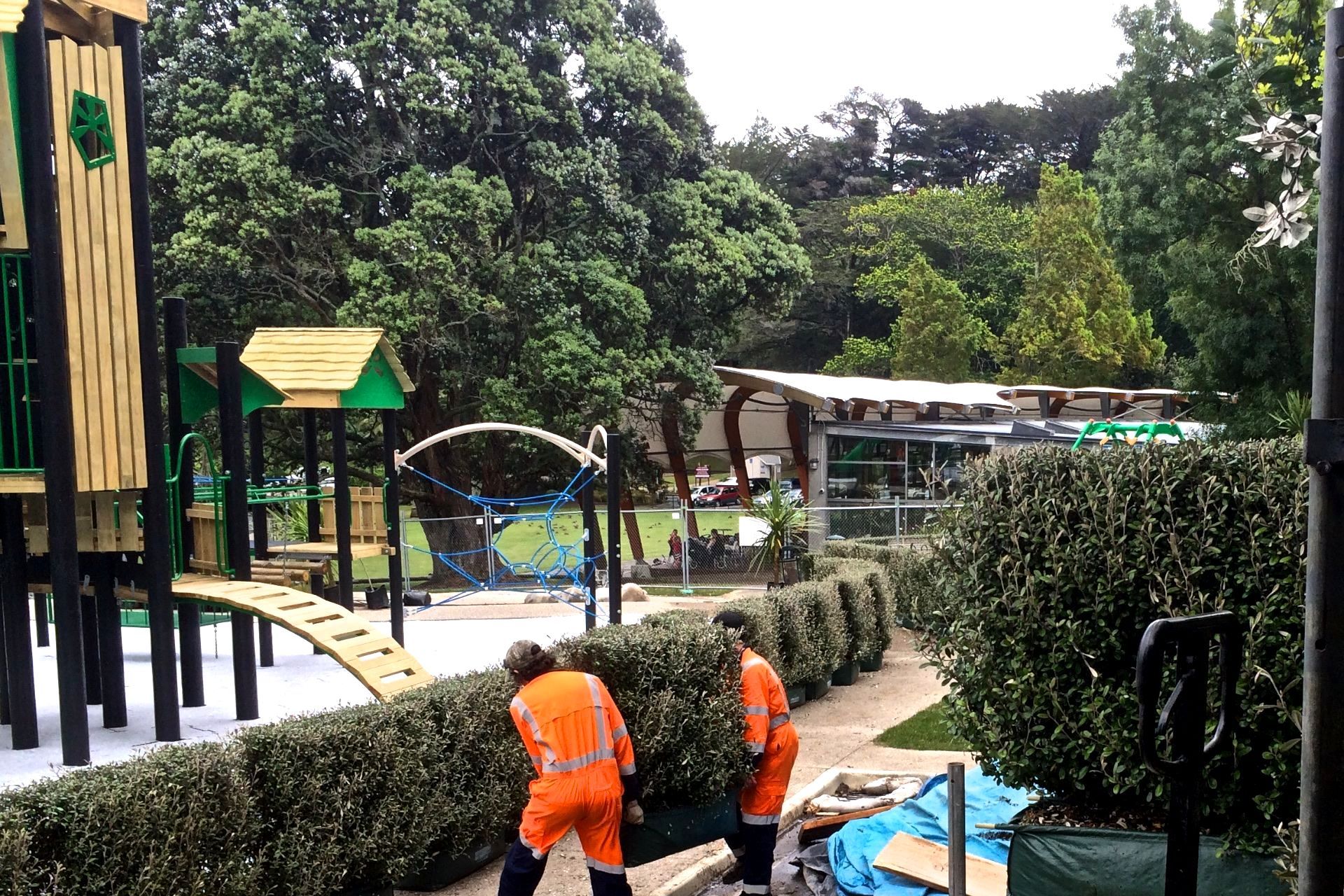 Adding the all-important finishing touches. Living Walls™ instant hedges create a natural barrier between the playground and pedestrians.