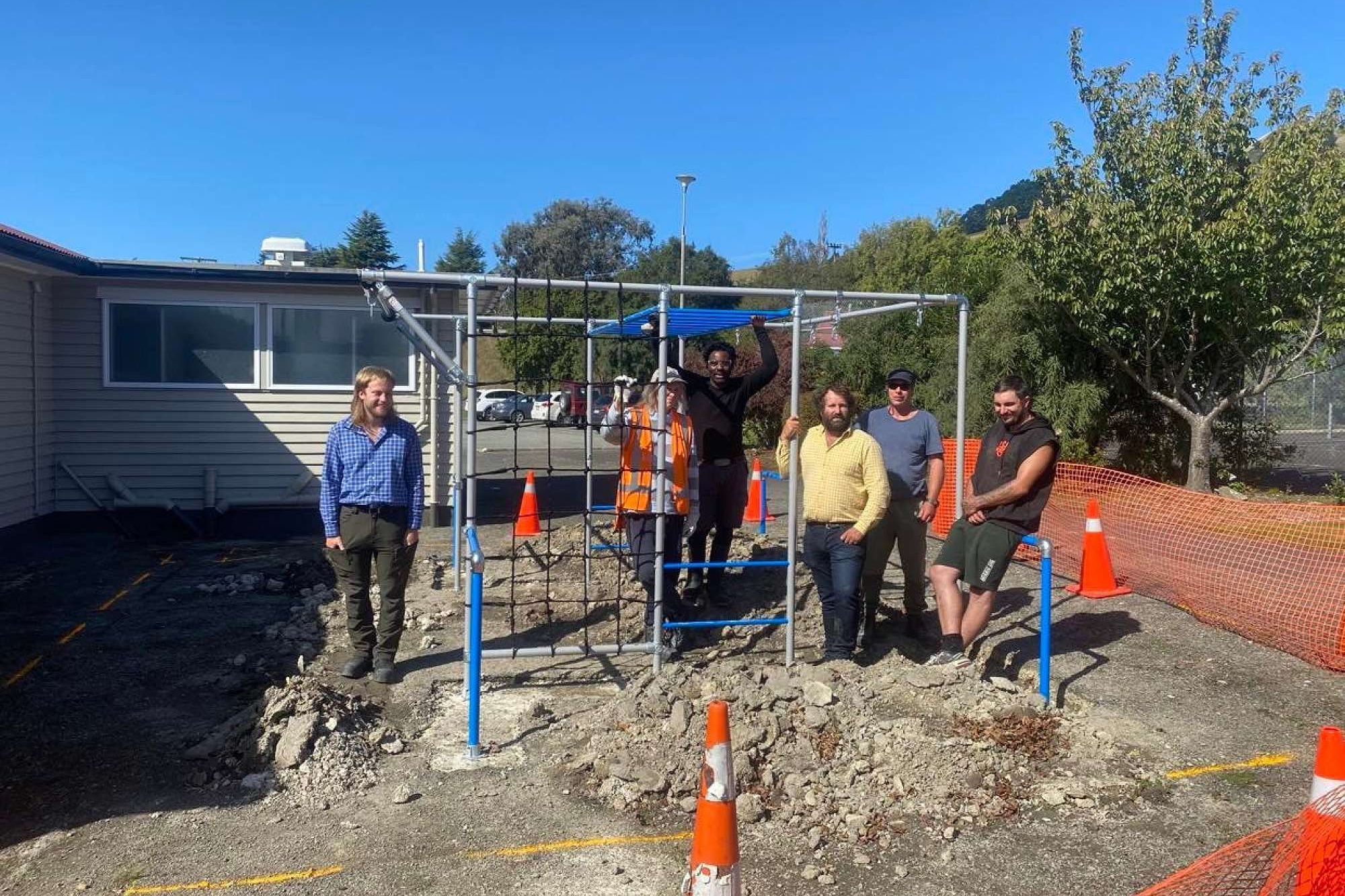 Photo of the JD Builders team: Regan (Quantity Surveyor), Jeff in the yellow shirt (CEO & Master Builder), Elizabeth, Patrick, Phil & Nick (Carpenters)