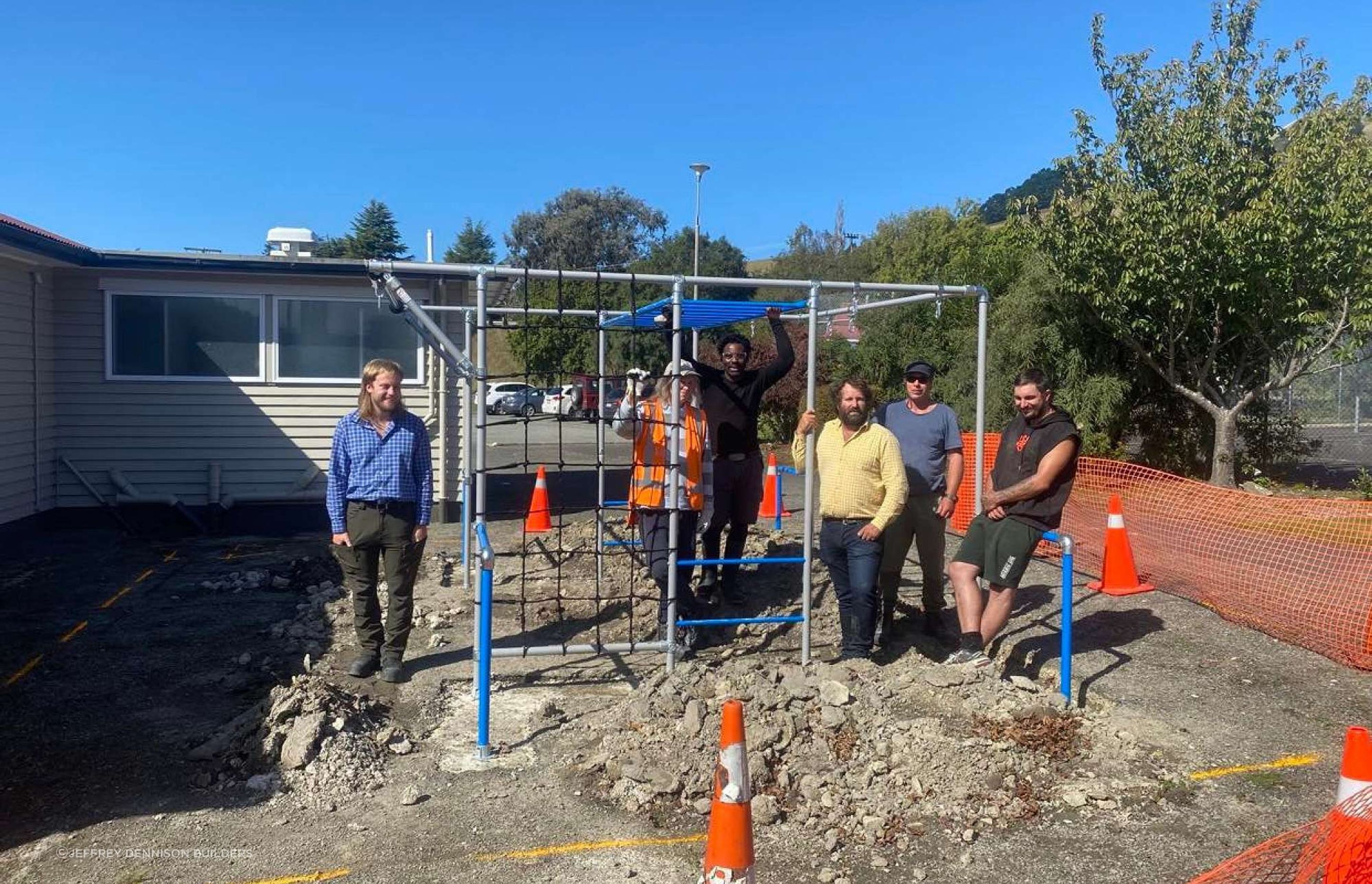 Photo of the JD Builders team: Regan (Quantity Surveyor), Jeff in the yellow shirt (CEO & Master Builder), Elizabeth, Patrick, Phil & Nick (Carpenters)