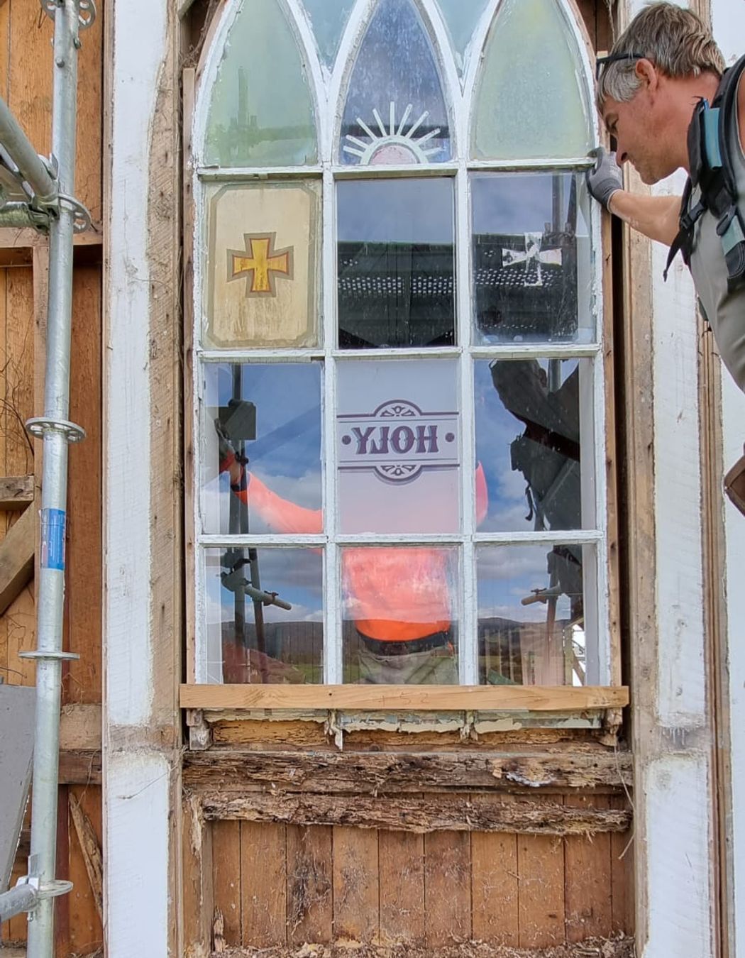 Revealing the rot and woodworm of the original window