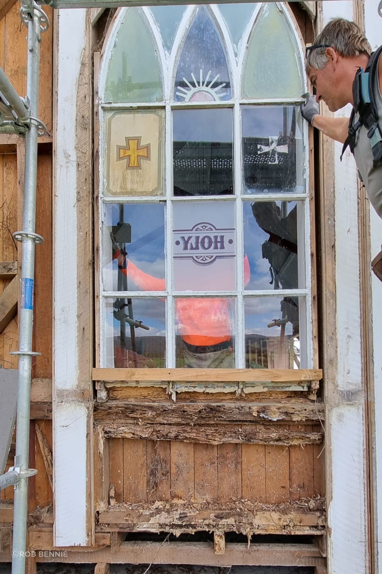 Revealing the rot and woodworm of the original window