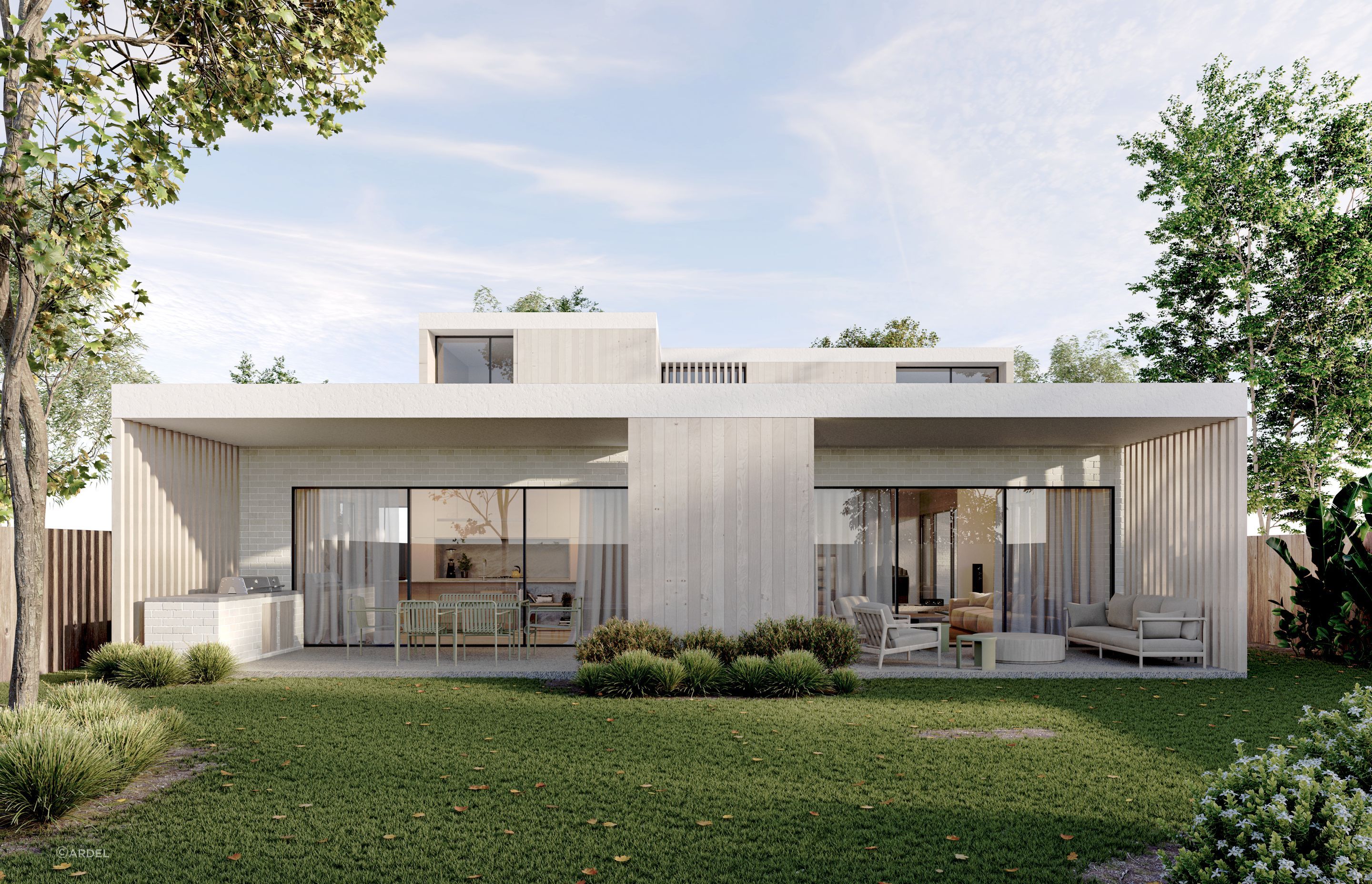 A clever extension to the internal living spaces, the entertaining area to the back of Cantilever House extends the length of the home and is accessed through sliding glass doors. Cool and shaded beneath a vast awning, the area is bathed in natural light via a central opening. Fitted with an inbuilt BBQ, the back patio is an idyllic space for entertaining or relaxing.