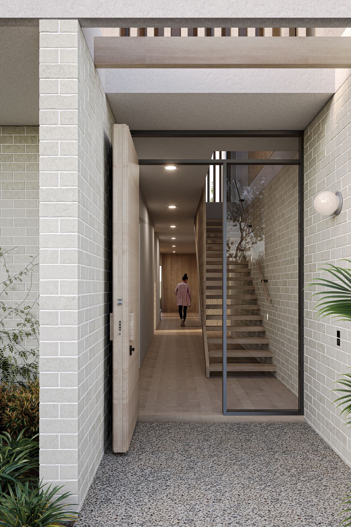 Bordered by light concrete brick walls, Cantilever’s entrance ushers natural light into the home via an open roof structure that compliments the entry. To the right, a double fronted garage hides discretely behind a pale timber façade, slotting carefully into the design of the built form.