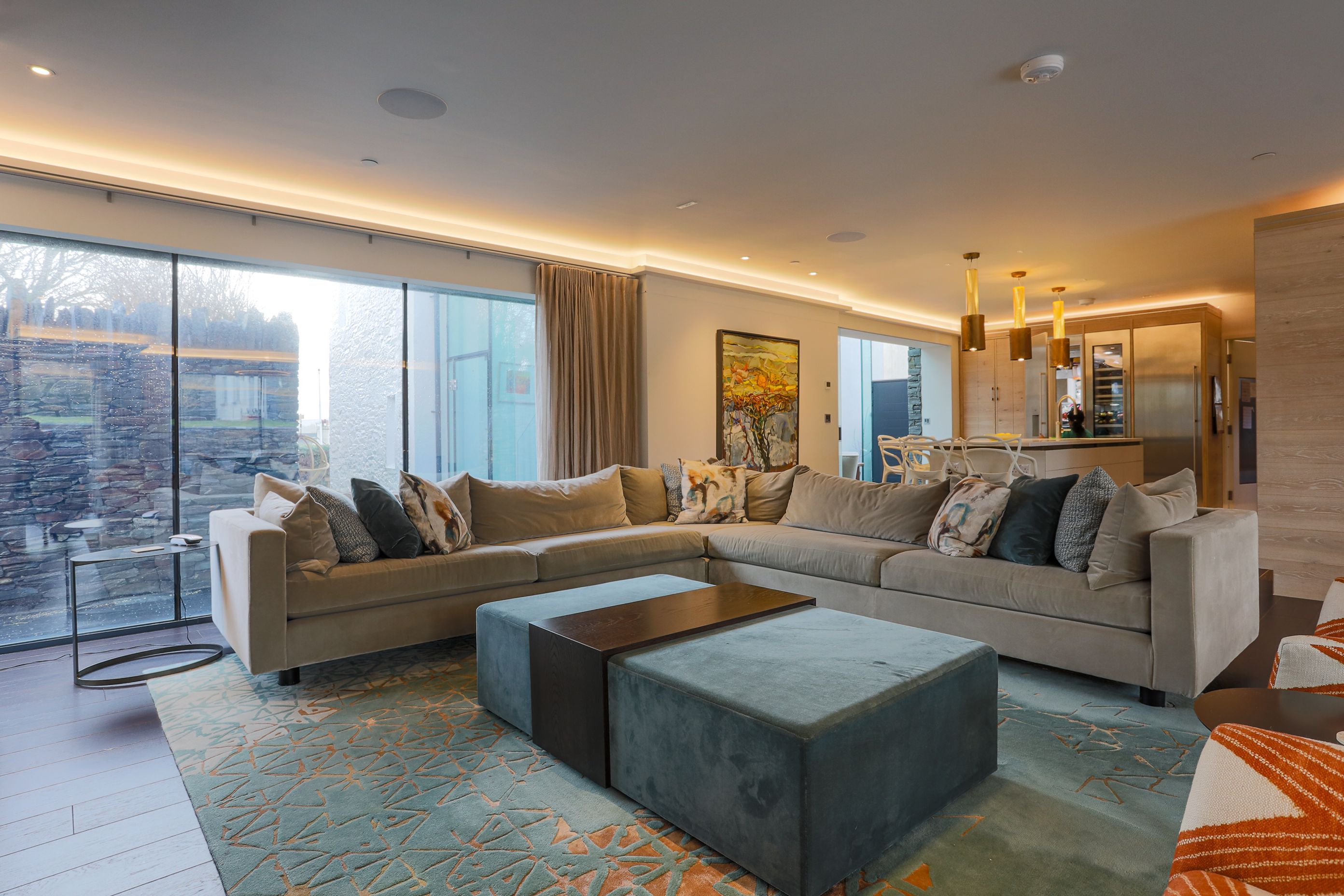 Stunning customised Floor rugs pull the colour scheme together.