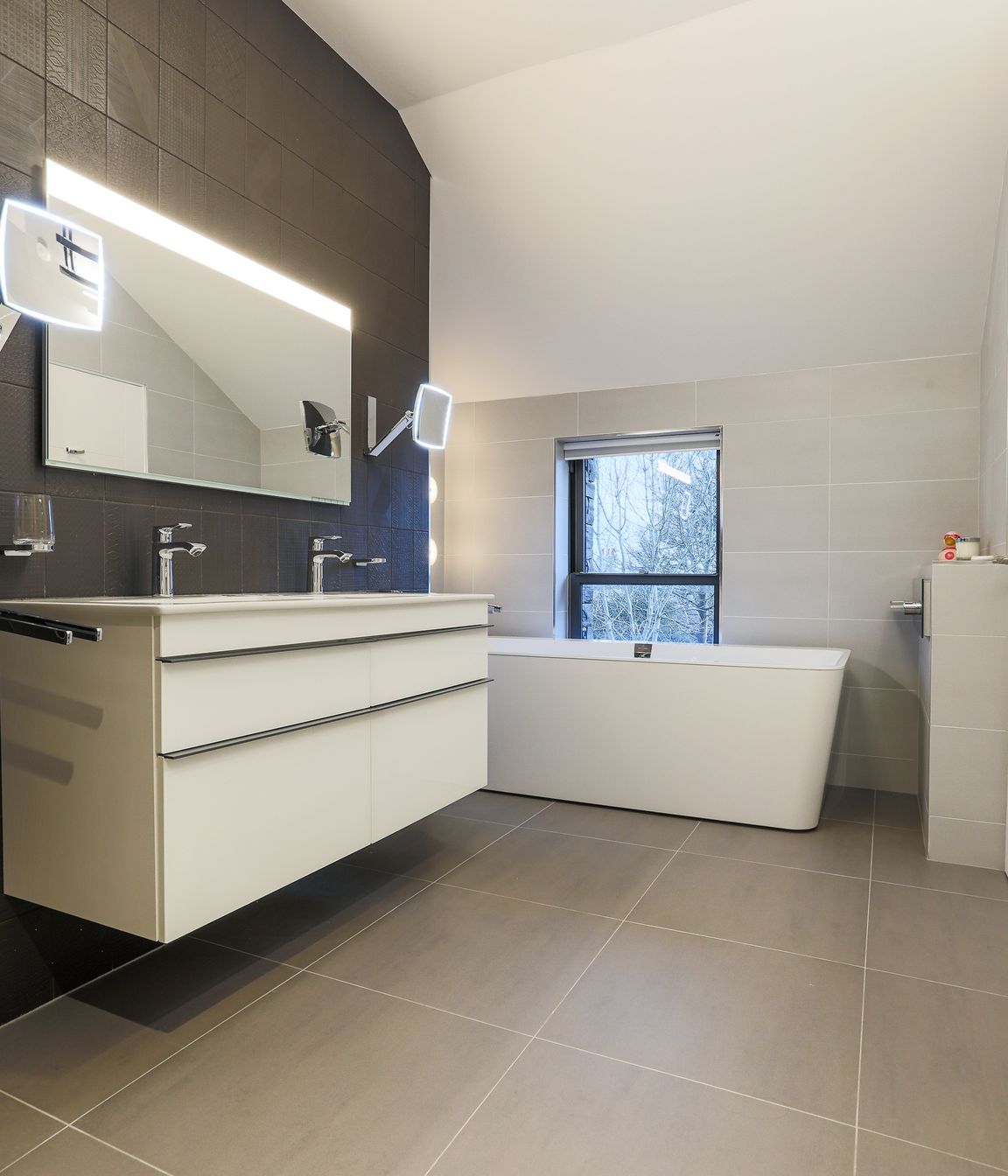 The Master ensuite walls were clad in handmade tiles, creating interest with pattern and texture.