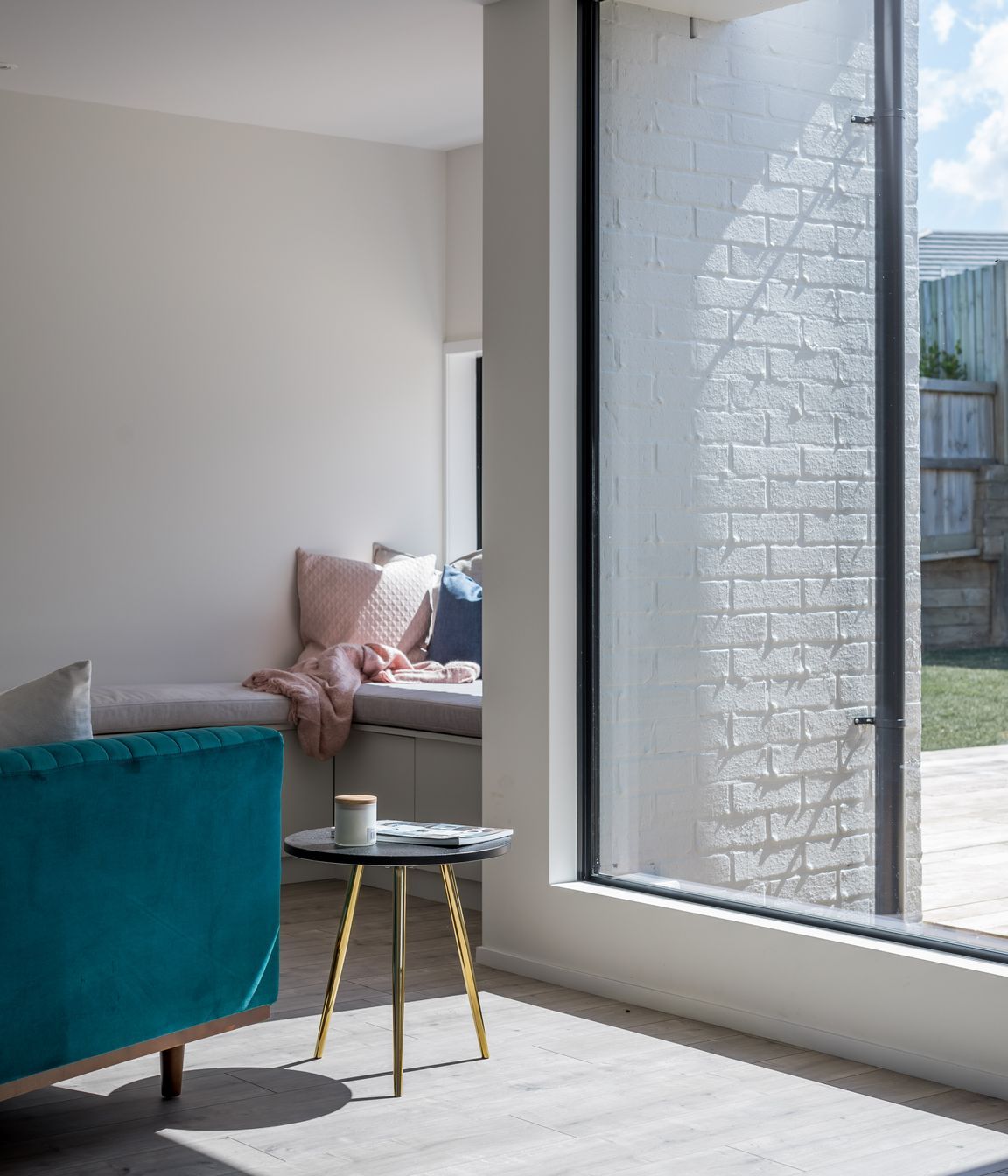 A second sitting area with built-in seating is a quiet spot to relax.