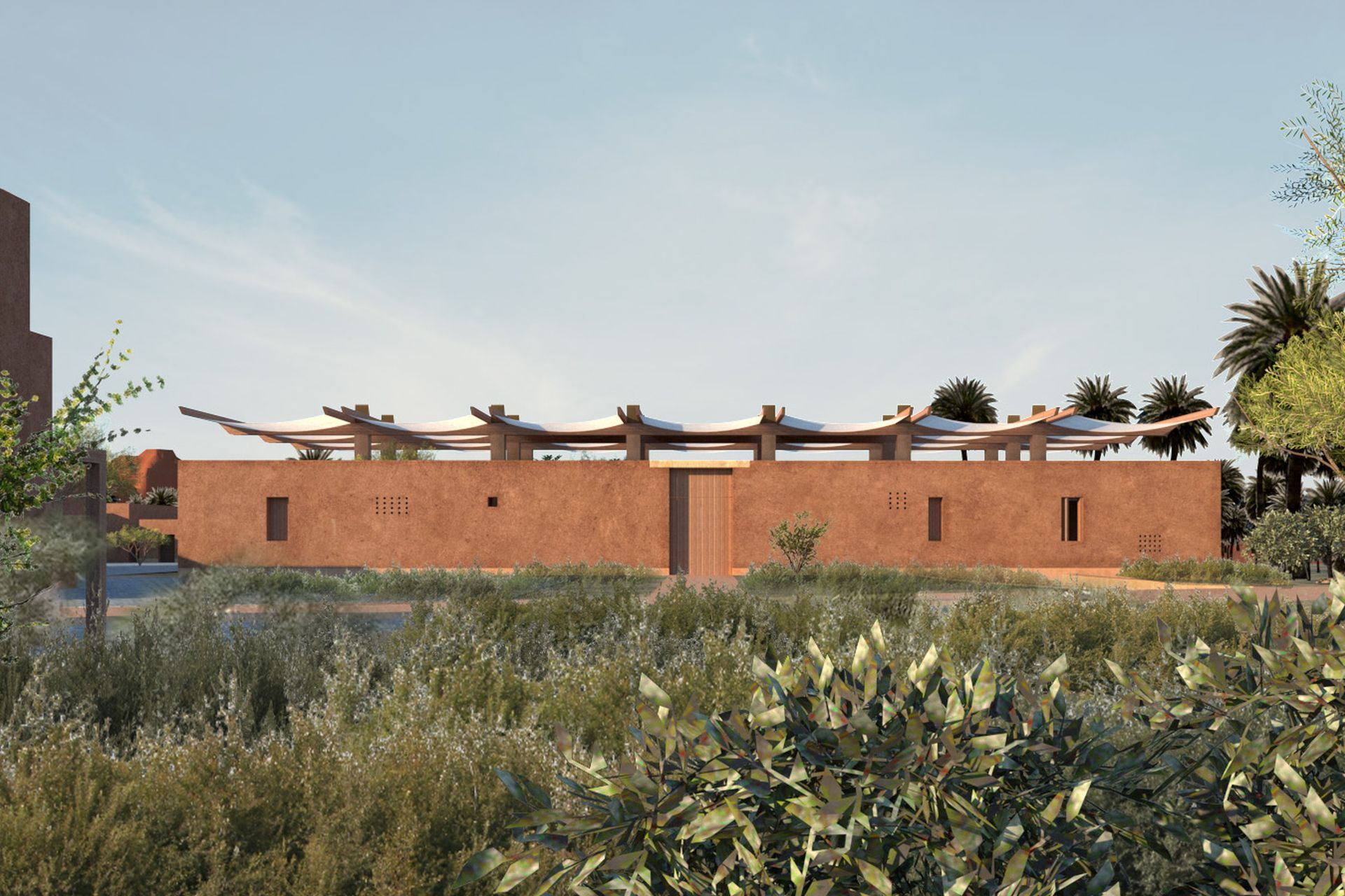 The parasol roof caps the building form, recalling vernacular structures of the context.