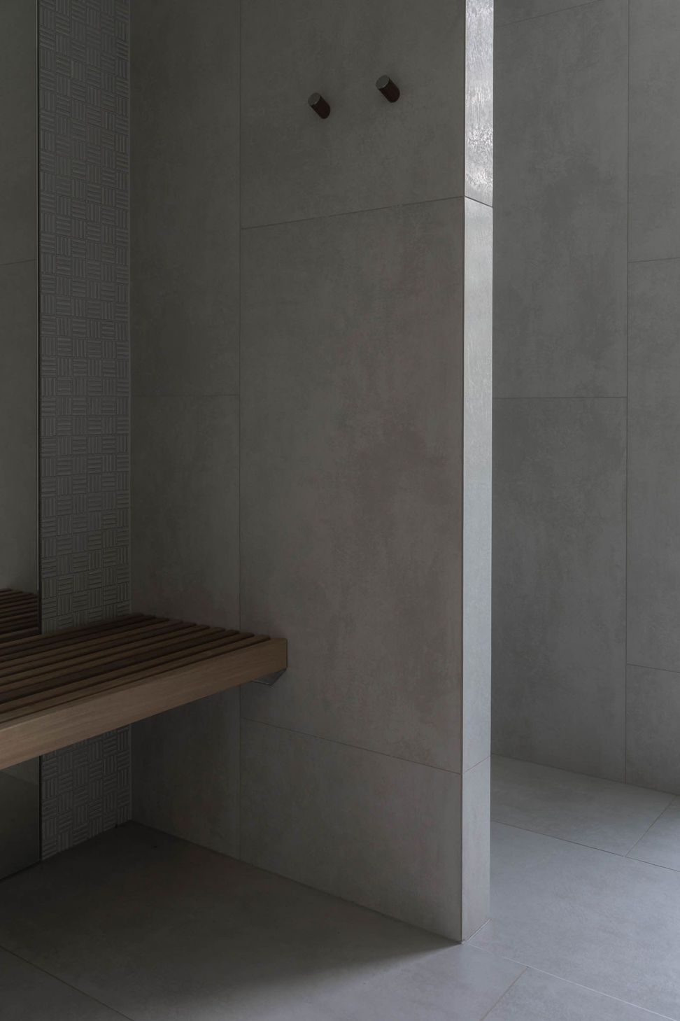 Eleutheria - Bathroom. Concrete walls with a floating timber vanity.