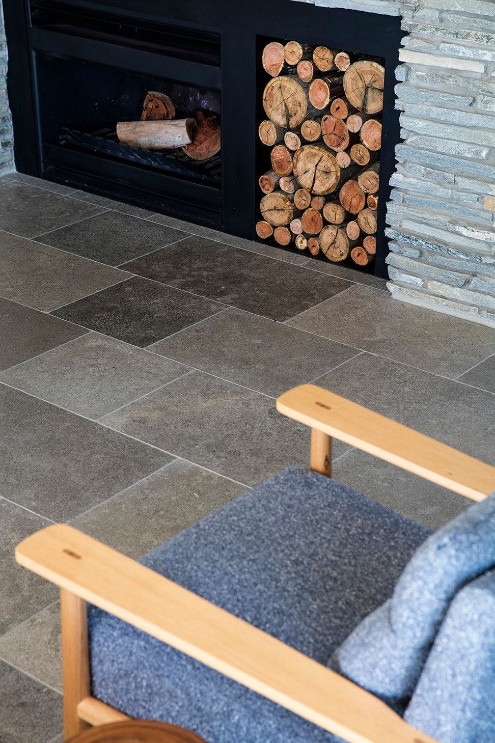Clark Residence - Living Room. Bluestone floor and firewood stack by the hearth.