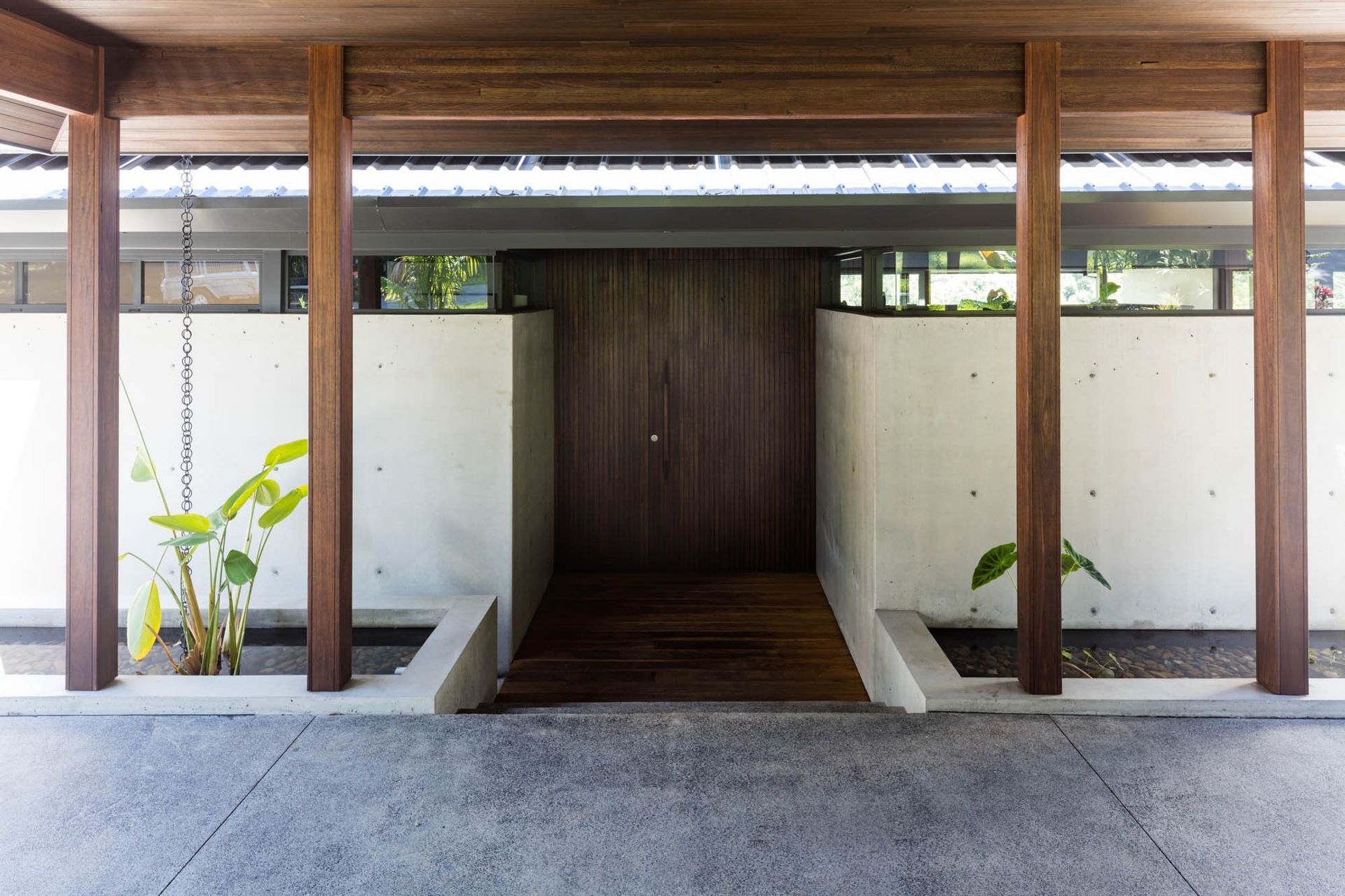 Watson Residence - Entry. Timber entry framed by concrete walls and posts.