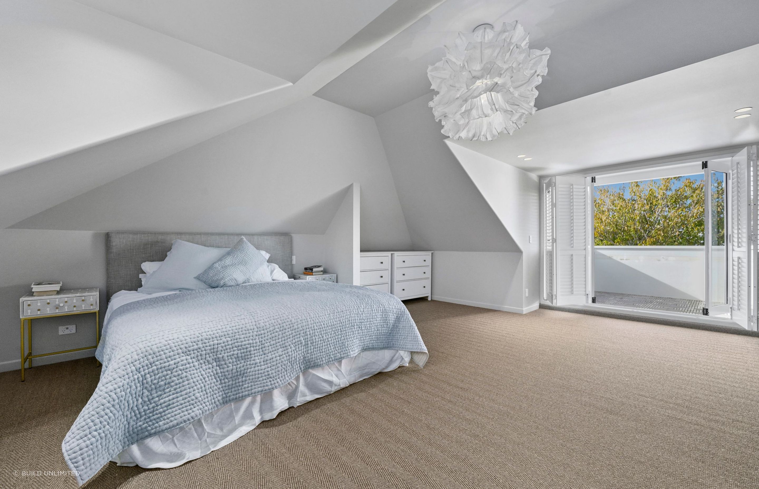 We carried the same finish through for a seamless feel. Flooring, paintwork, and lighting all work together to make this space feel restful and refined.