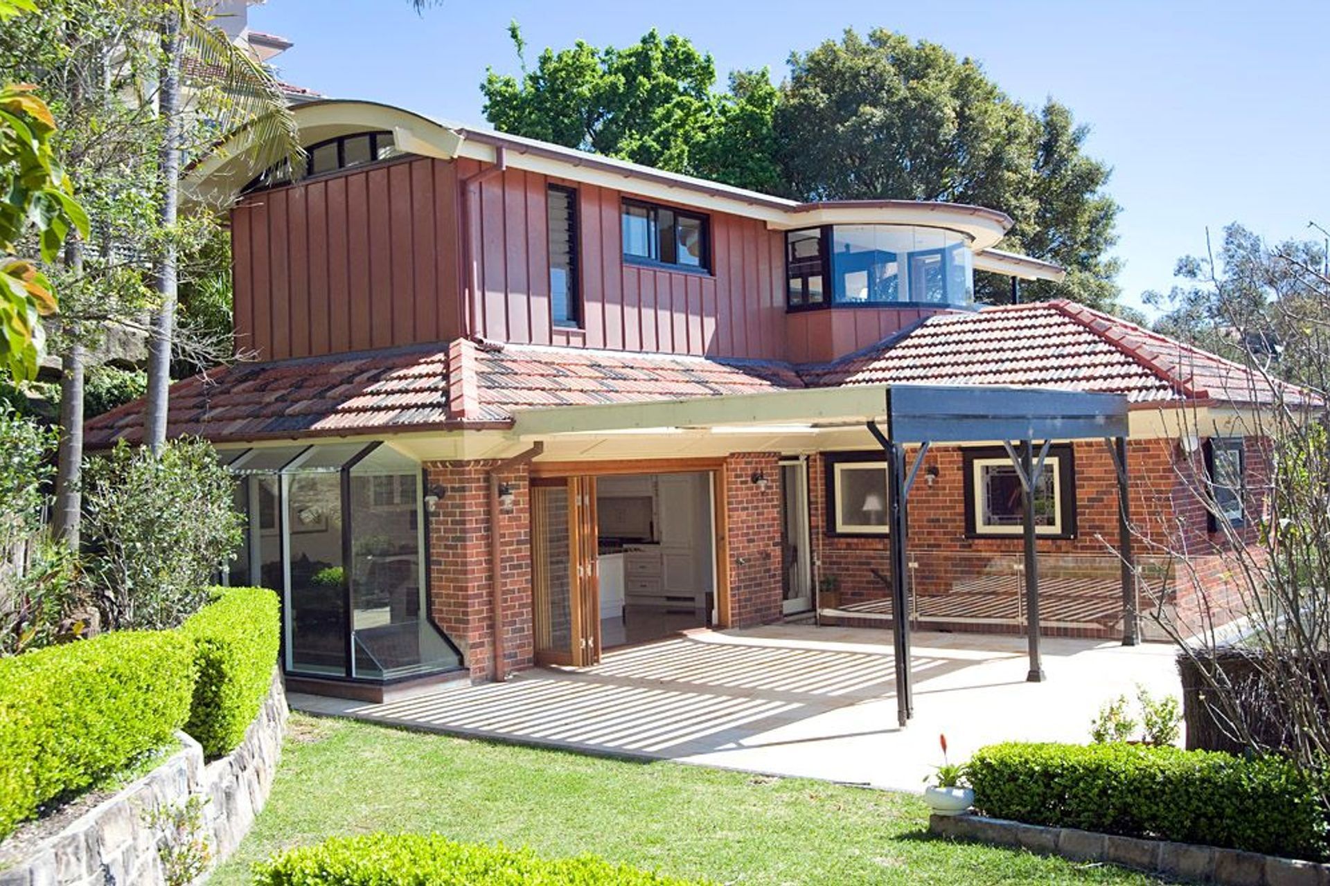 View from rear yard showing new upper level addition and existing dwelling