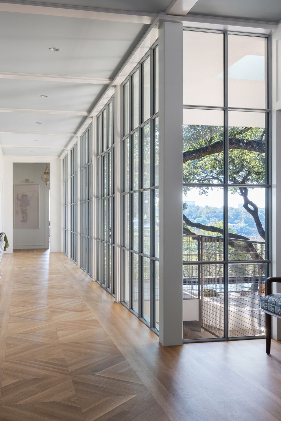 11Pemberton-HeightsCuppett-Kilpatrick-Architecture-and-Interior-Designhallway-steel-european-windows-chevron-wood-flooring-austin-tx.jpg