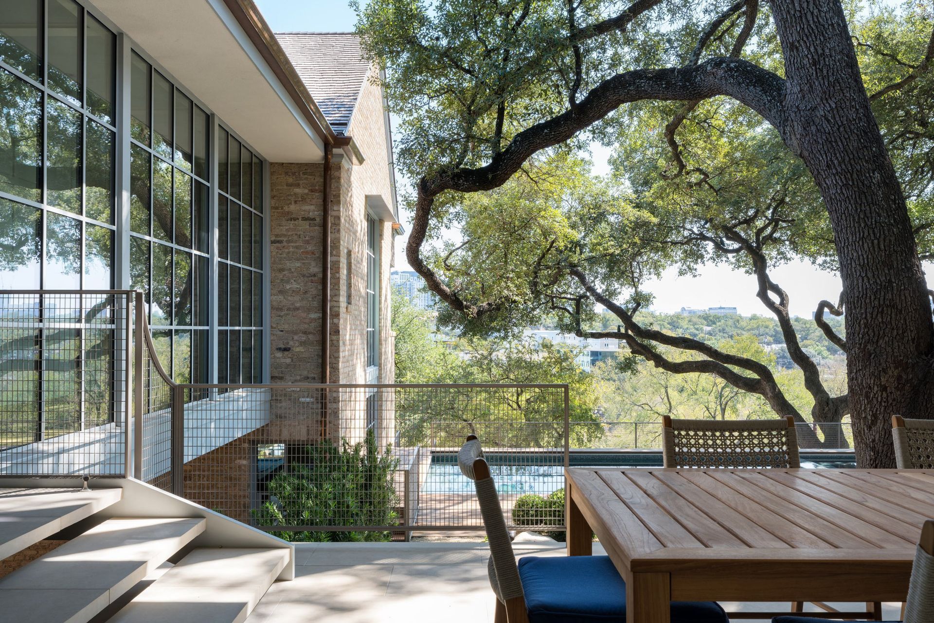 12Pemberton-HeightsCuppett-Kilpatrick-Architecture-and-Interior-Designoutdoor-patio-steel-windows-oak-tree-views-austin-tx.jpg