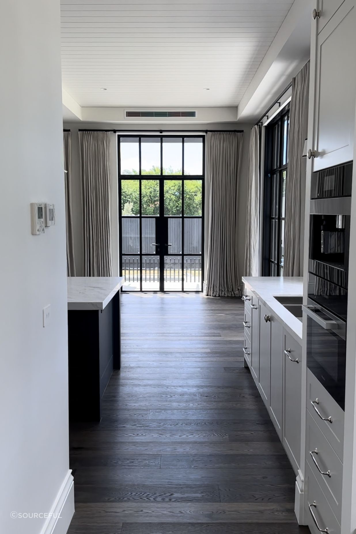 Living room - Featuring automated rods and linen drapes