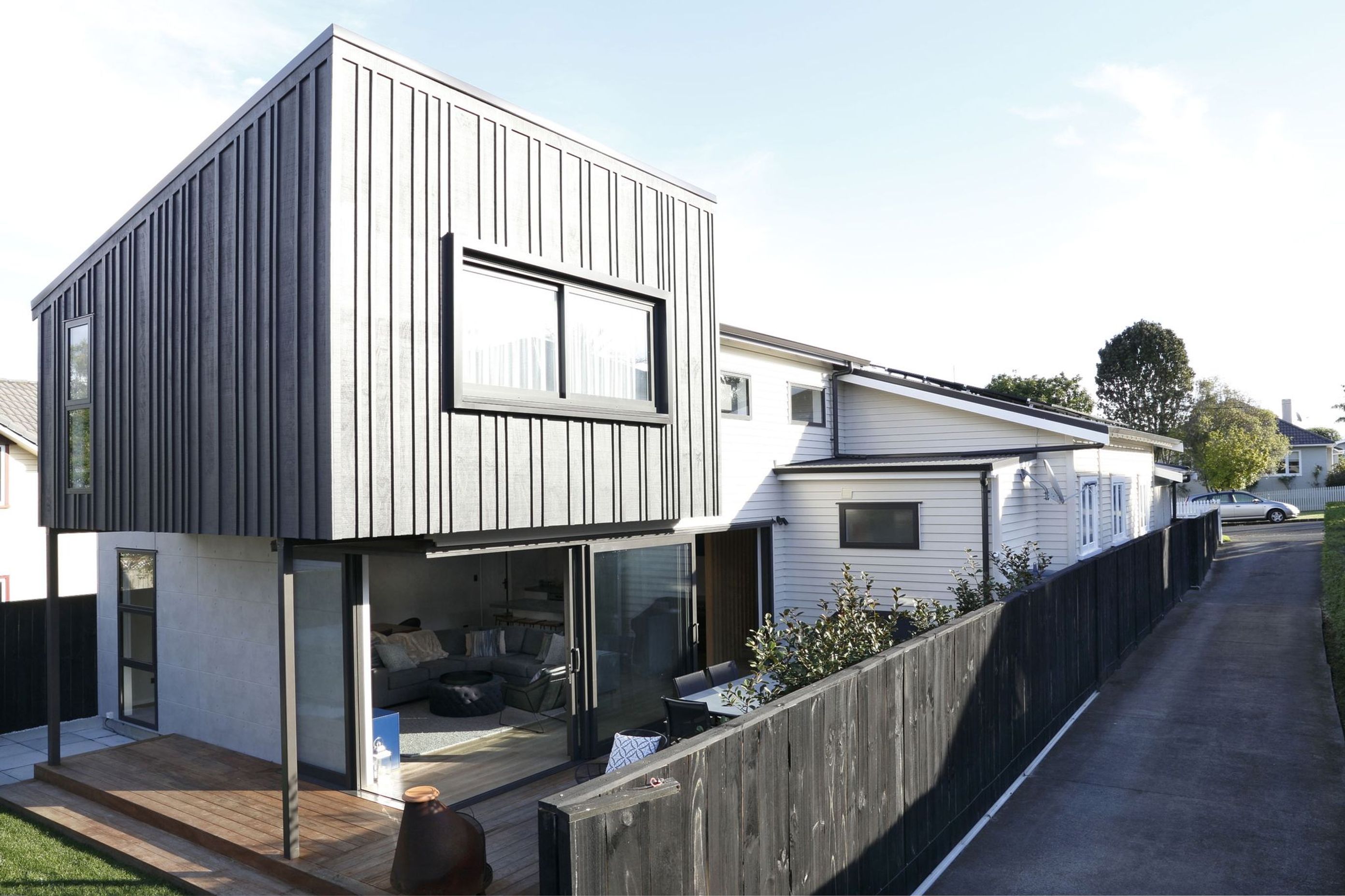 Black addition on a contemporary Auckland bungalow house