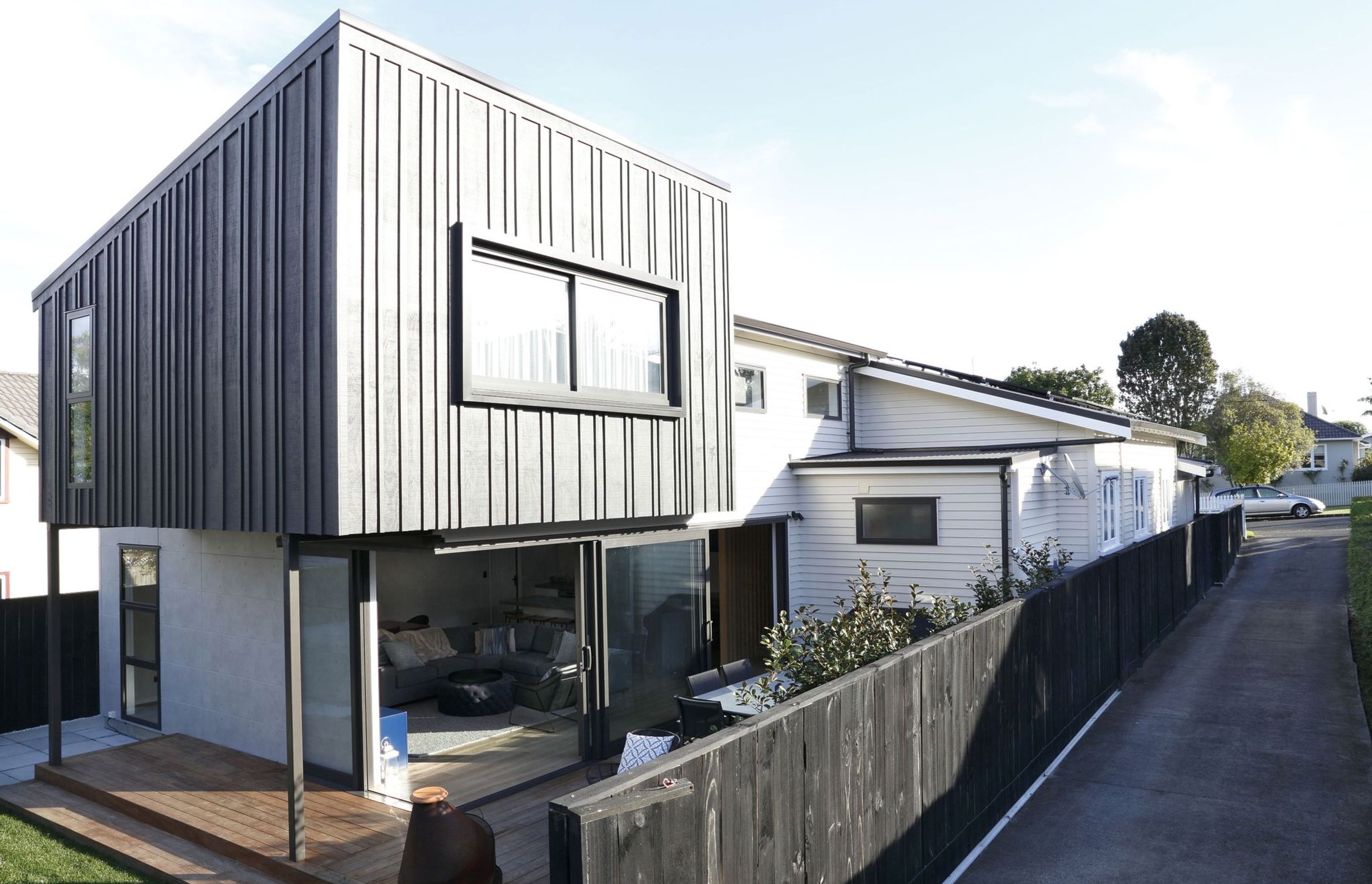 Black addition on a contemporary Auckland bungalow house
