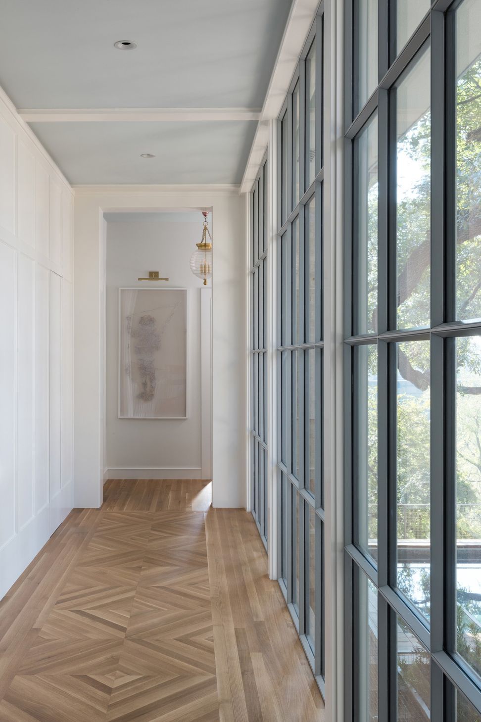 6Pemberton-HeightsCuppett-Kilpatrick-Architecture-and-Interior-Designelegant-hallway-steel-european-windows-chevron-wood-flooring-austin-tx.jpg