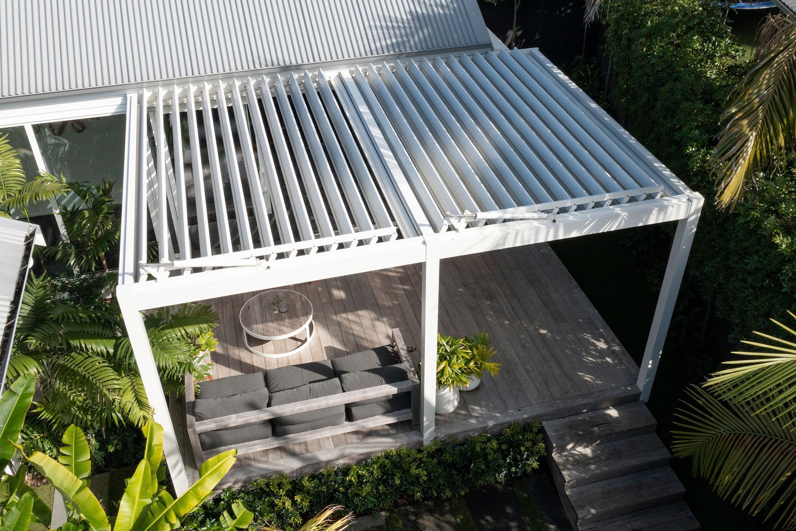 Auckland Home Project. Louvre Roof and Gate Create Oasis of Tranquillity
